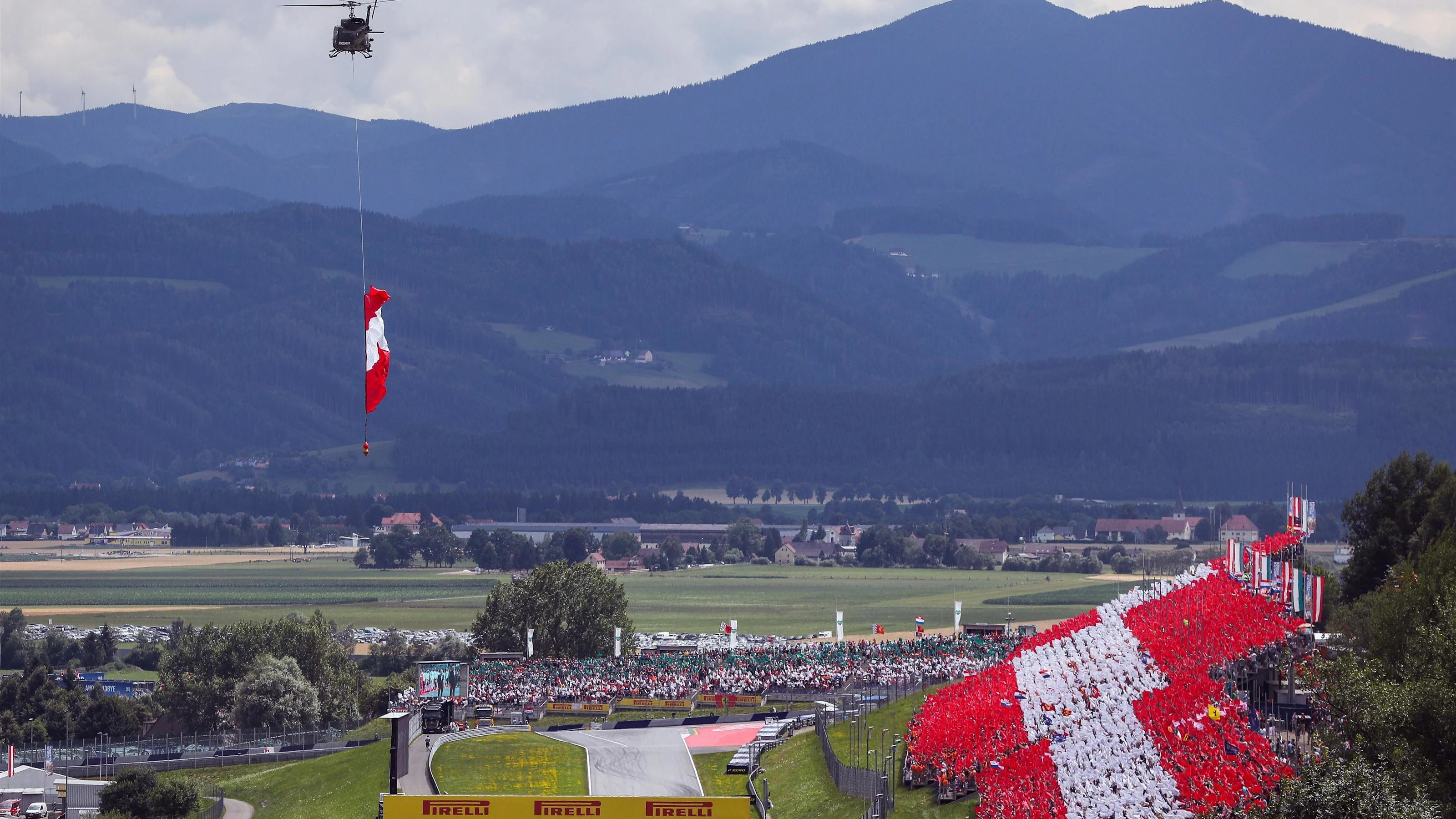 Helicopter with Austrian flag and grandstand at Formula One World Championship, Rd9, Austrian Grand