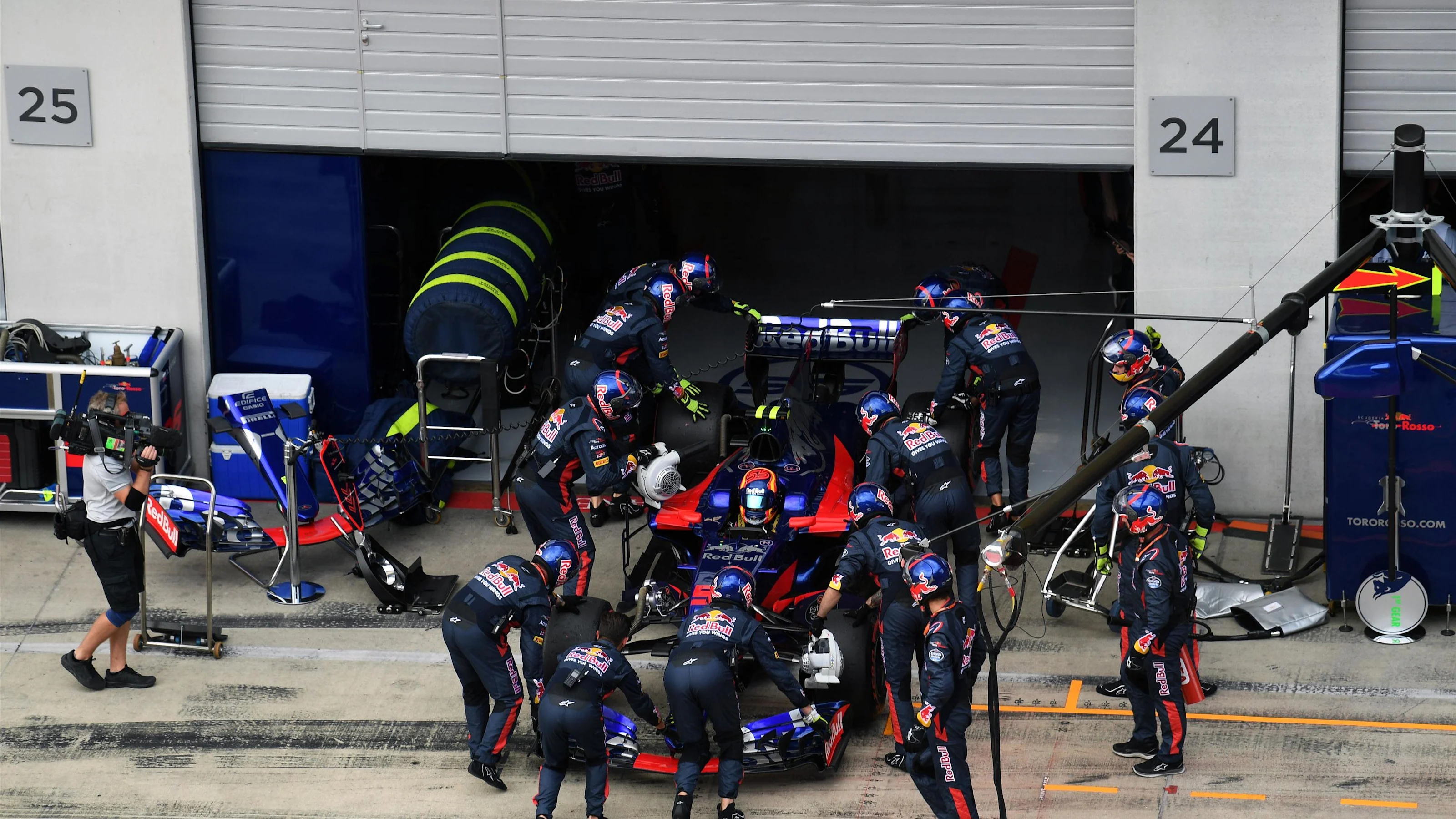 The car of race retiree Carlos Sainz jr (ESP) Scuderia Toro Rosso STR12 is pushed back into the