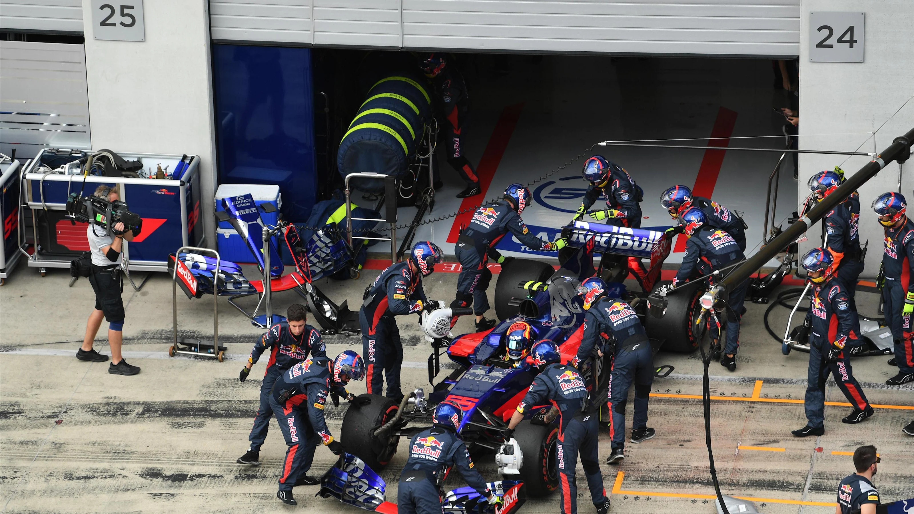 The car of race retiree Carlos Sainz jr (ESP) Scuderia Toro Rosso STR12 is pushed back into the