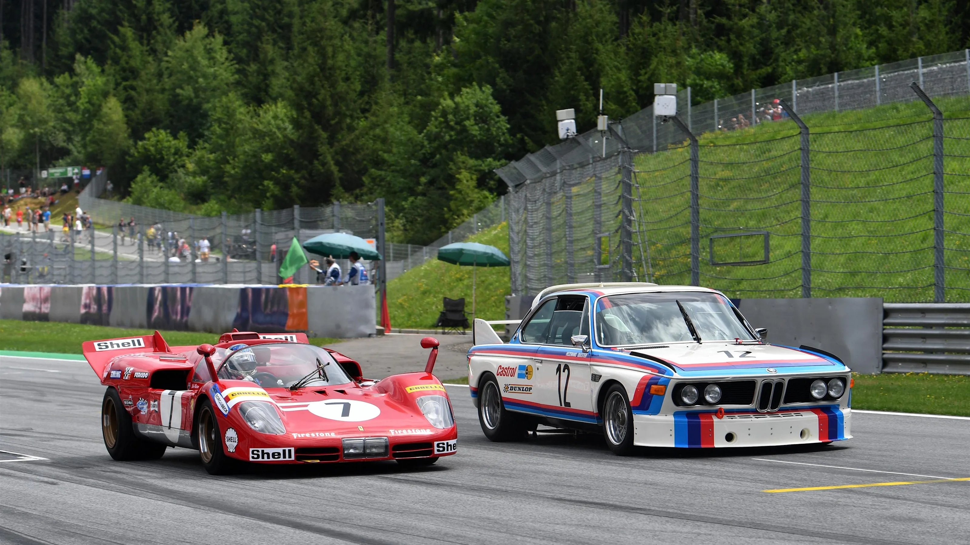 Jean Alesi (FRA) Ferrari 512S and Dieter Quester (GER) BMW 3.0 CSL on the Legends Parade at Formula