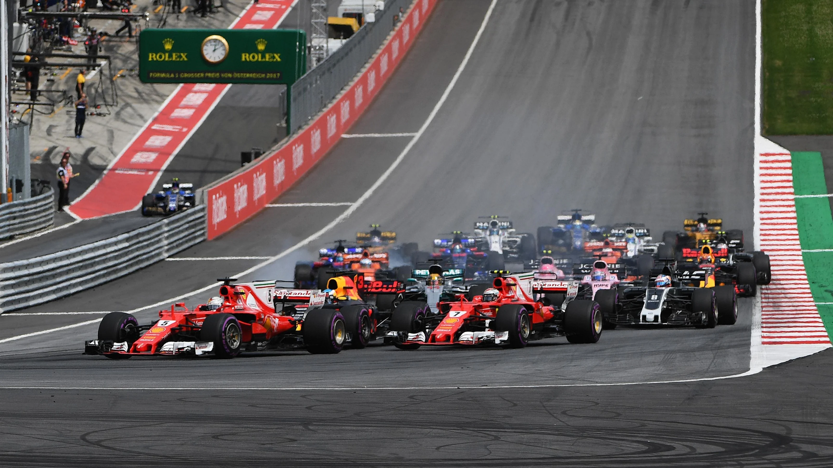 Sebastian Vettel (GER) Ferrari SF70-H and Kimi Raikkonen (FIN) Ferrari SF70-H at the start of the