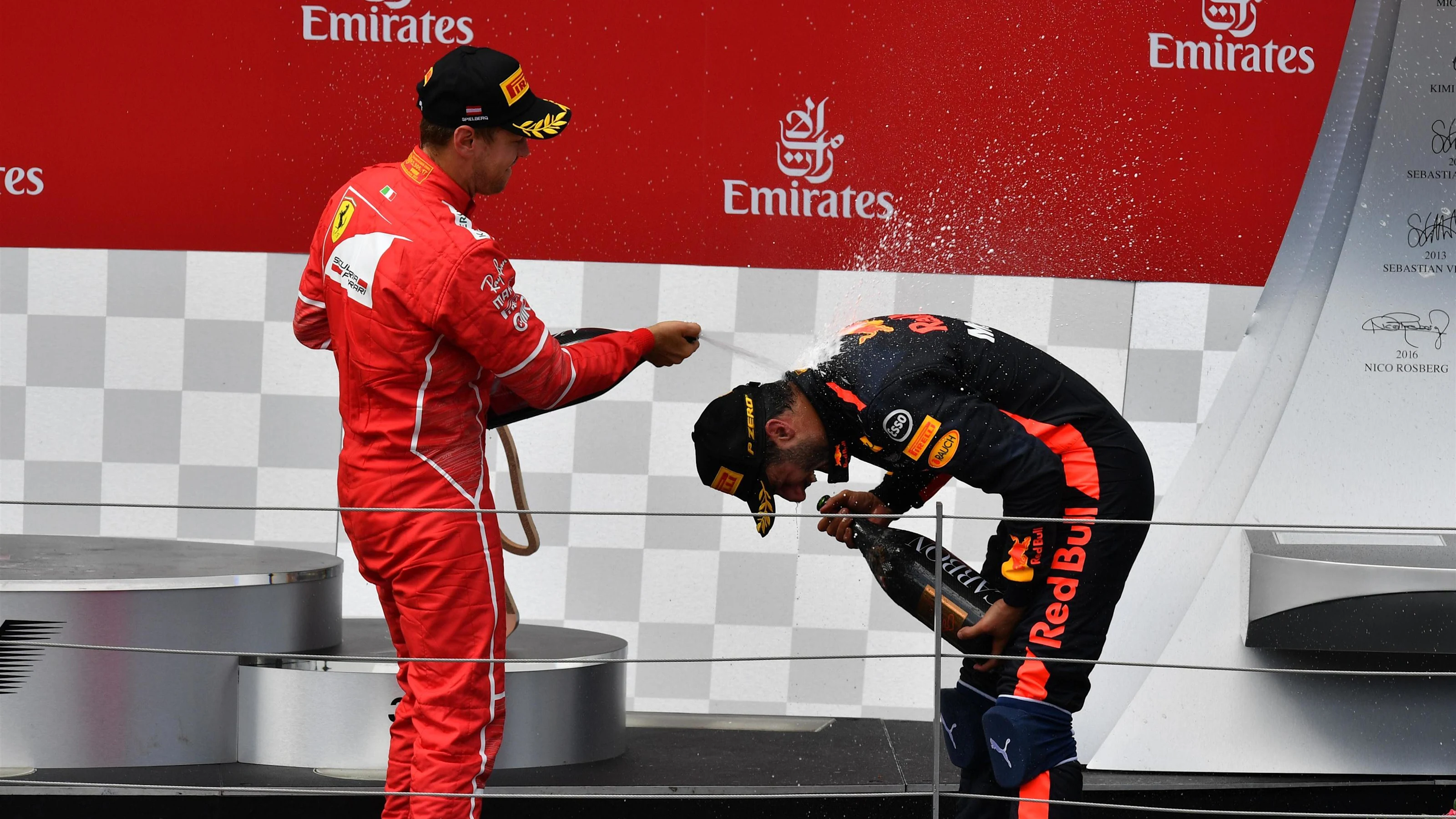 Sebastian Vettel (GER) Ferrari and Daniel Ricciardo (AUS) Red Bull Racing celebrate on the podium