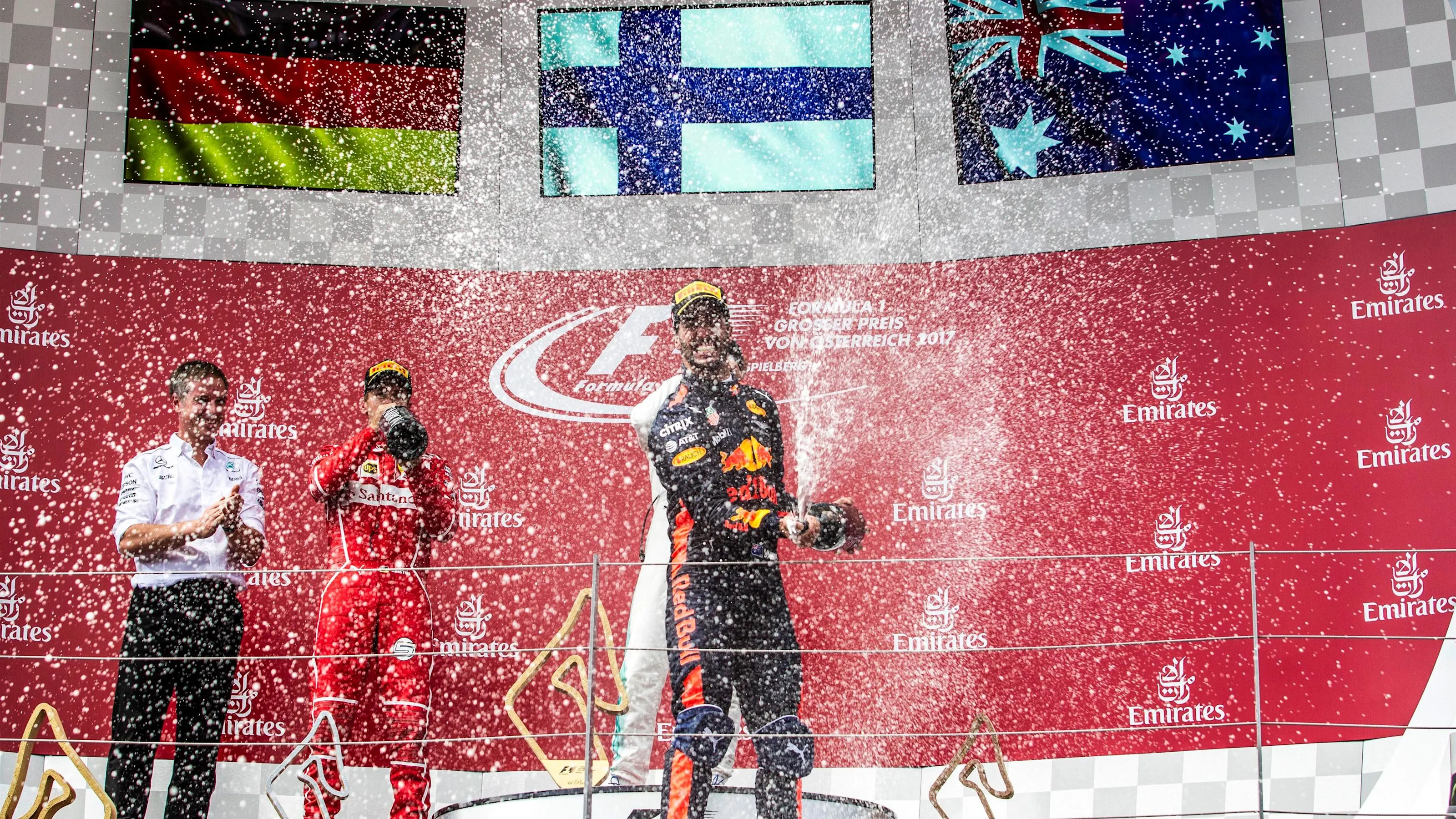Daniel Ricciardo (AUS) Red Bull Racing celebrates iwht the champagne on the podium at Formula One