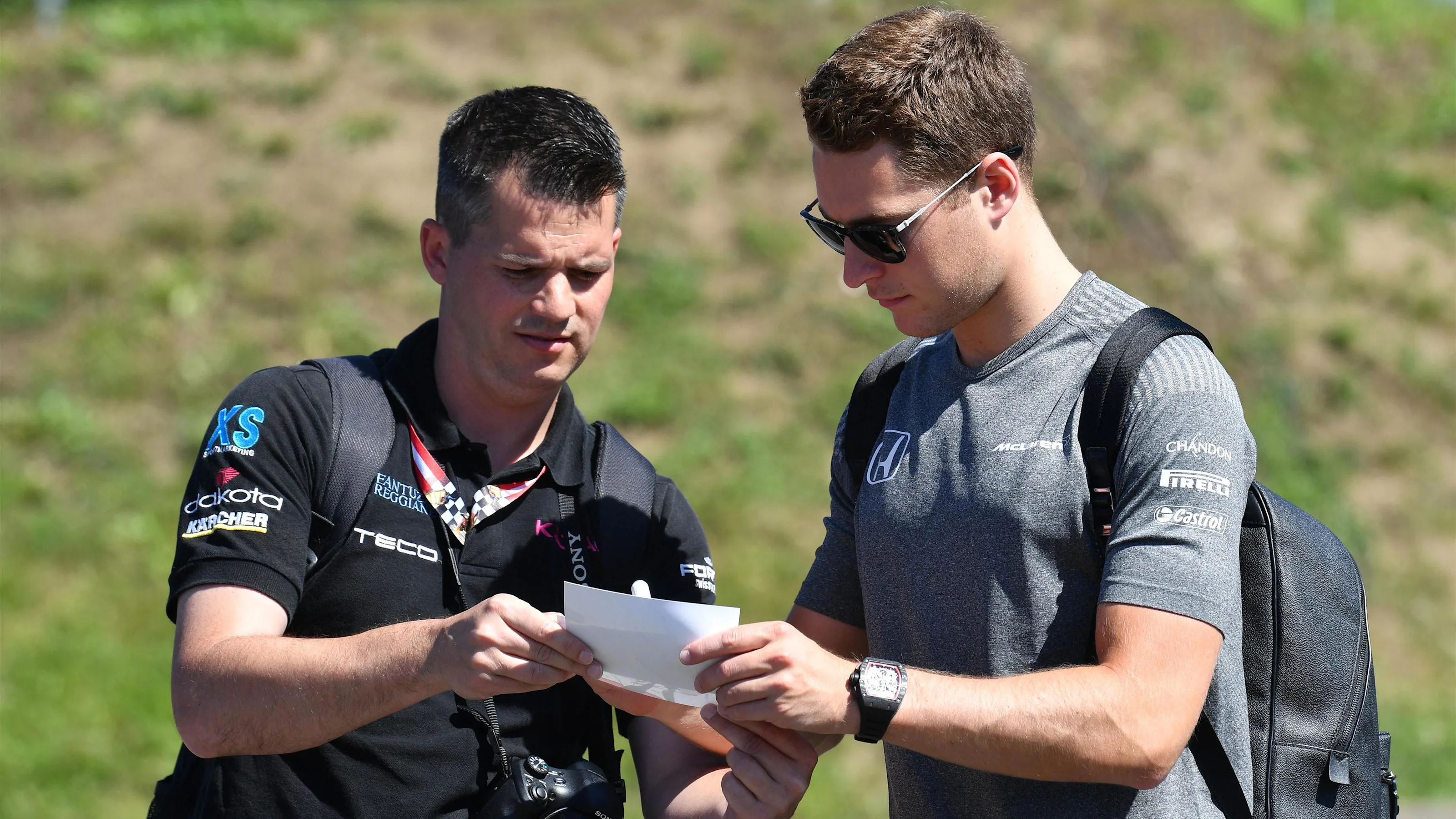 Stoffel Vandoorne (BEL) McLaren signs autographs for a fan at Formula One World Championship, Rd9,