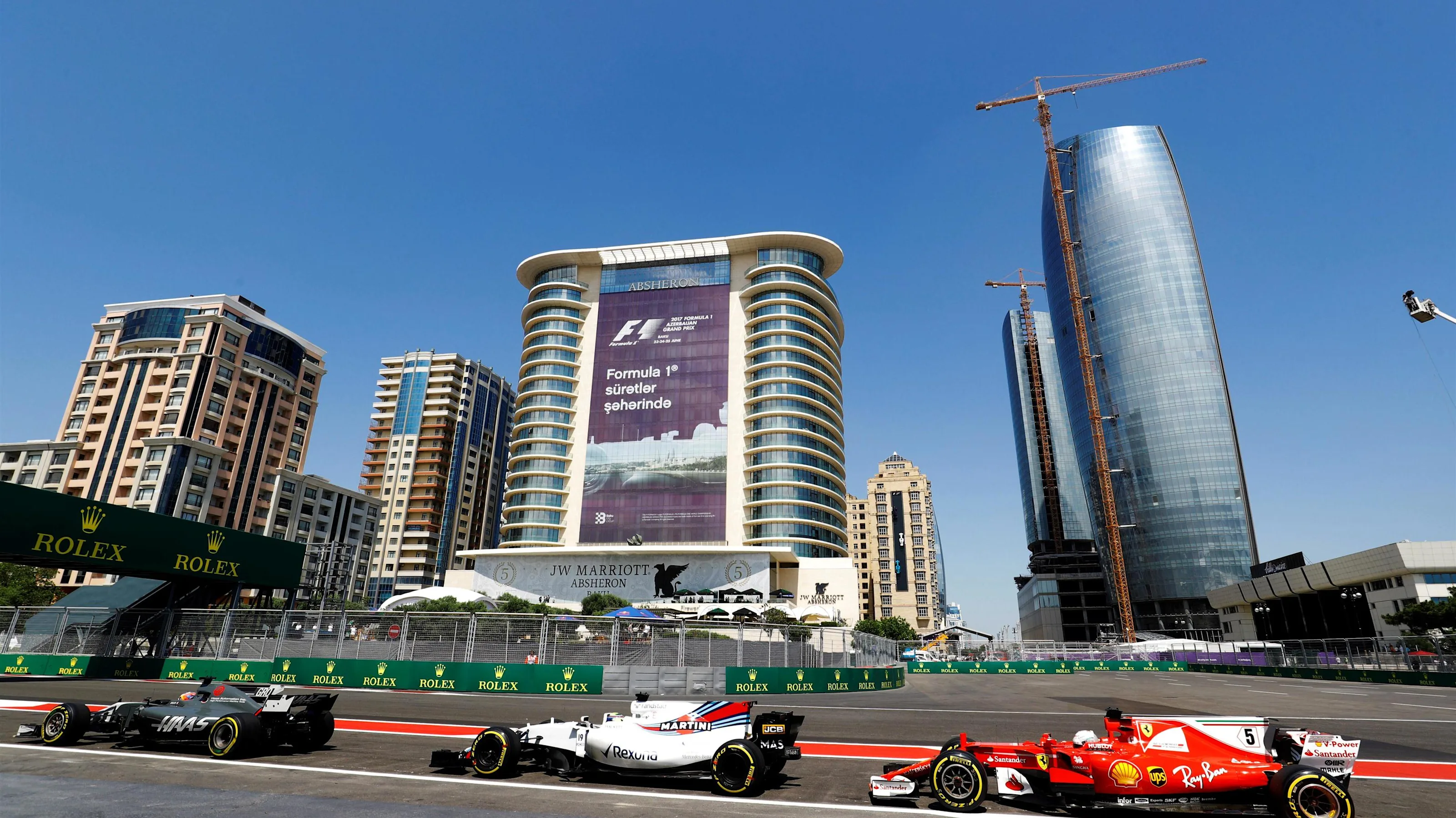 Romain Grosjean (FRA) Haas VF-17, Felipe Massa (BRA) Williams FW40 and Sebastian Vettel (GER)