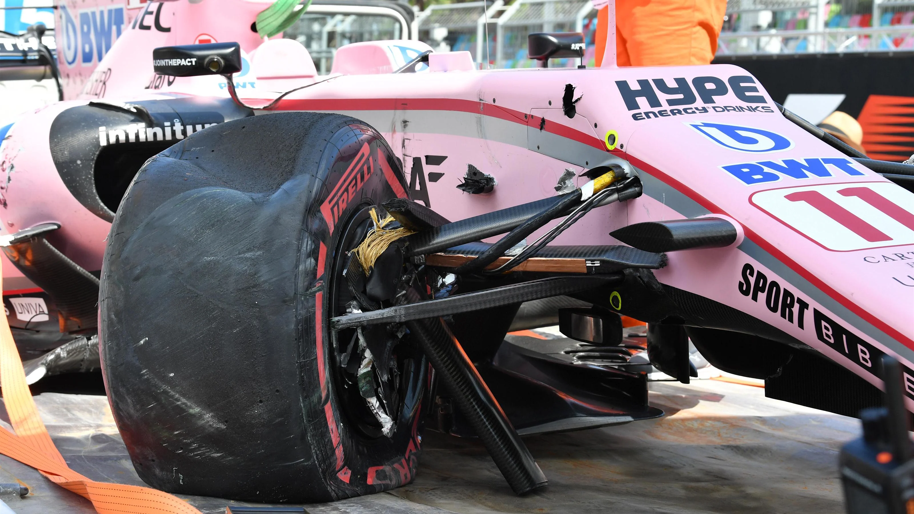 The crashed car of Sergio Perez (MEX) Force India VJM10 is recovered after FP1 at Formula One World