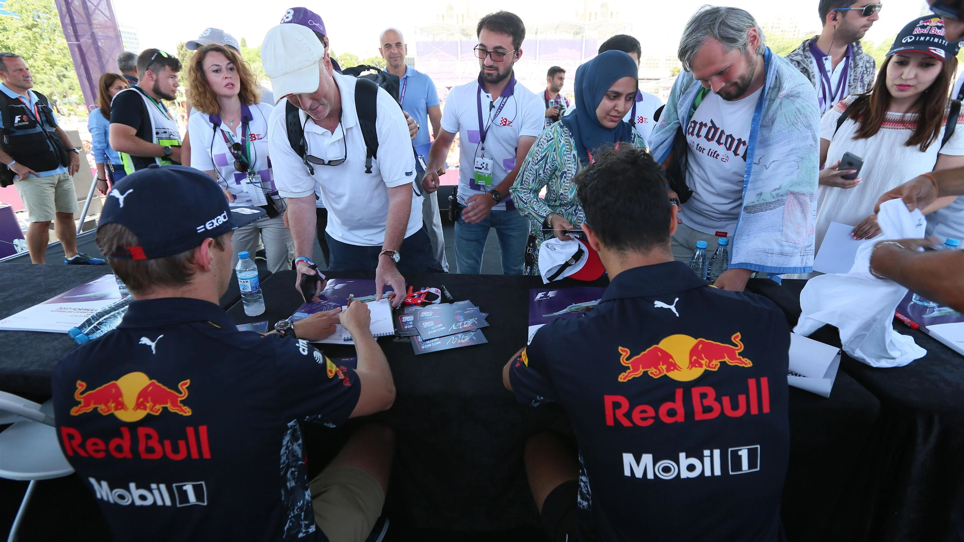 Max Verstappen (NED) Red Bull Racing and Daniel Ricciardo (AUS) Red Bull Racing sign autographs for