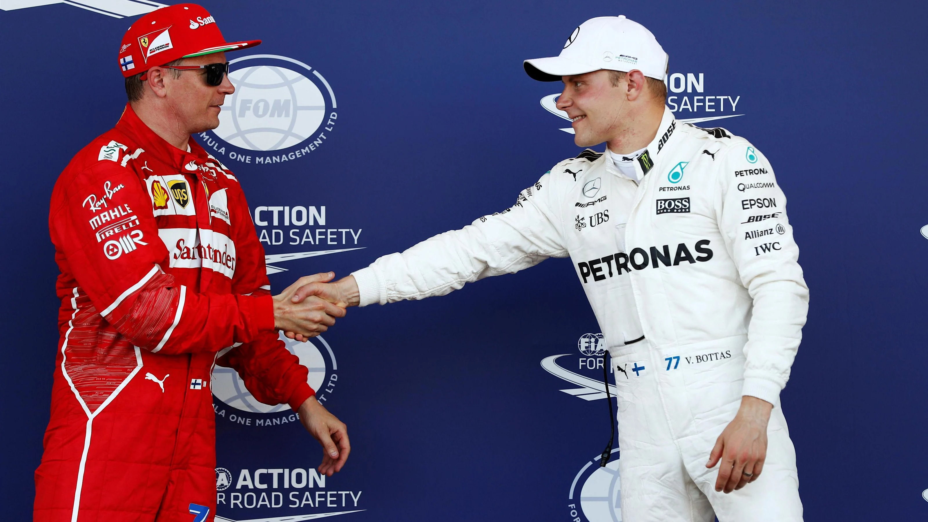 Kimi Raikkonen (FIN) Ferrari and Valtteri Bottas (FIN) Mercedes AMG F1 celebrate in parc ferme at