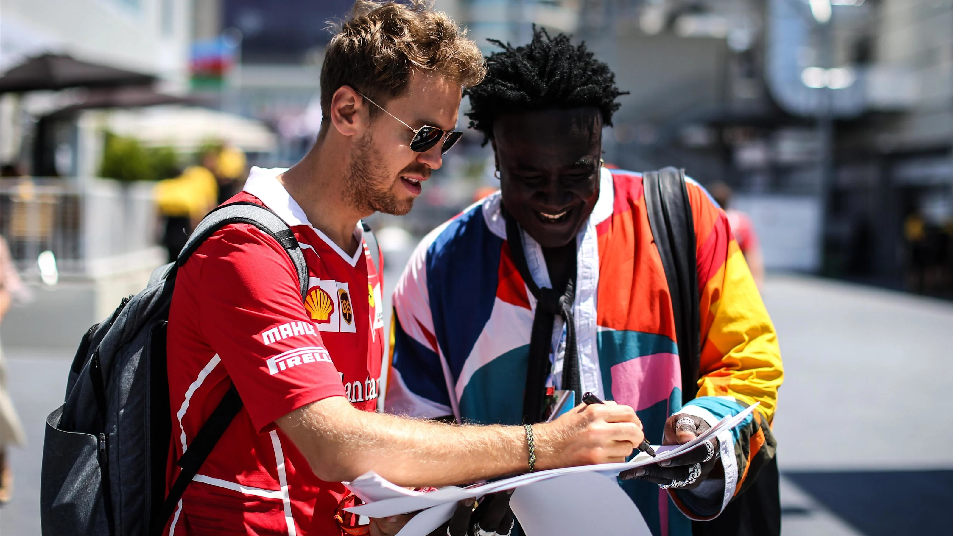 Sebastian Vettel (GER) Ferrari and Mr Moko (SEN) Chrome Hearts Jewellary at Formula One World