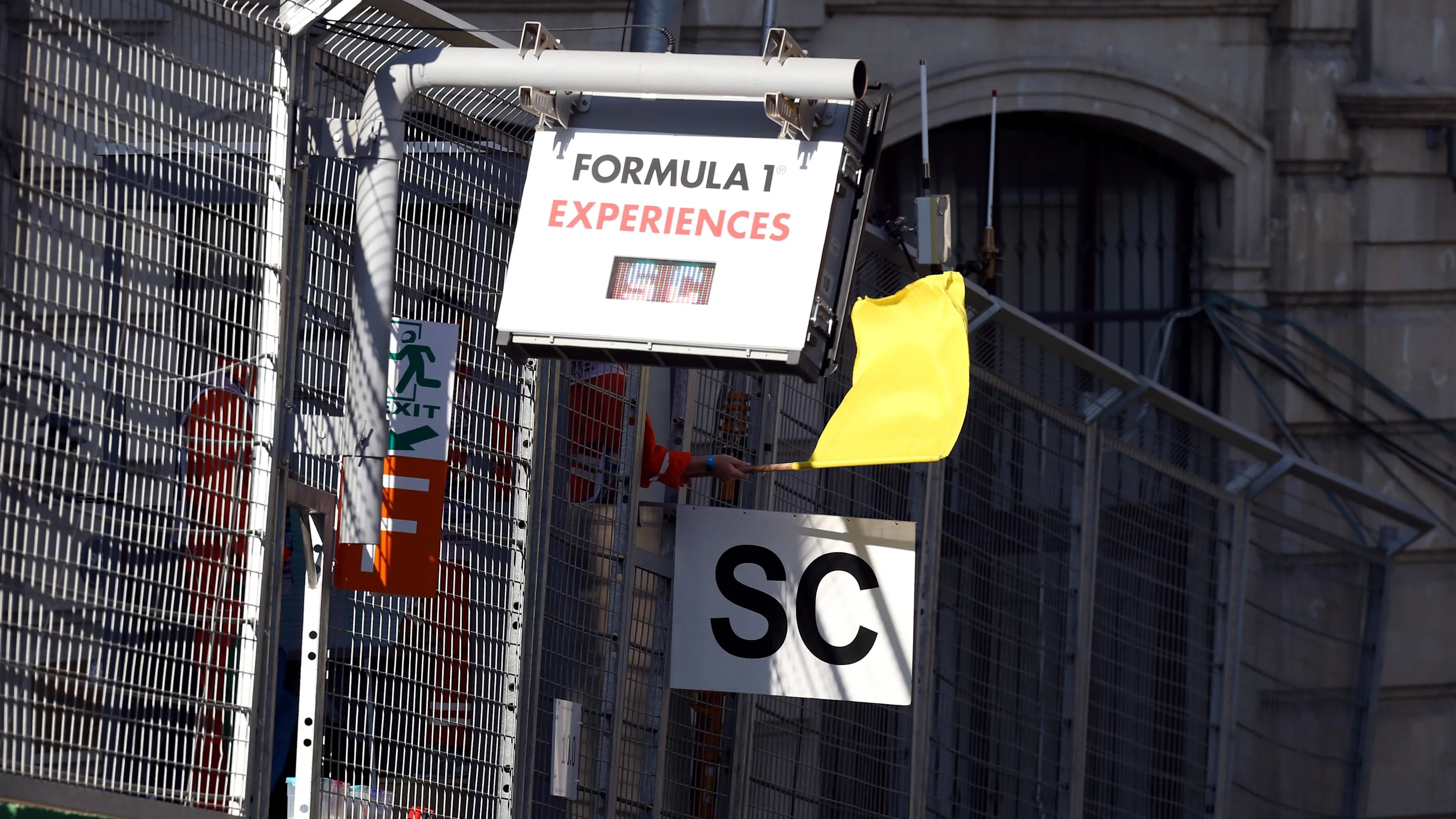 Marshal waves the Yellow Flag and Safety Car board at Formula One World Championship, Rd8,