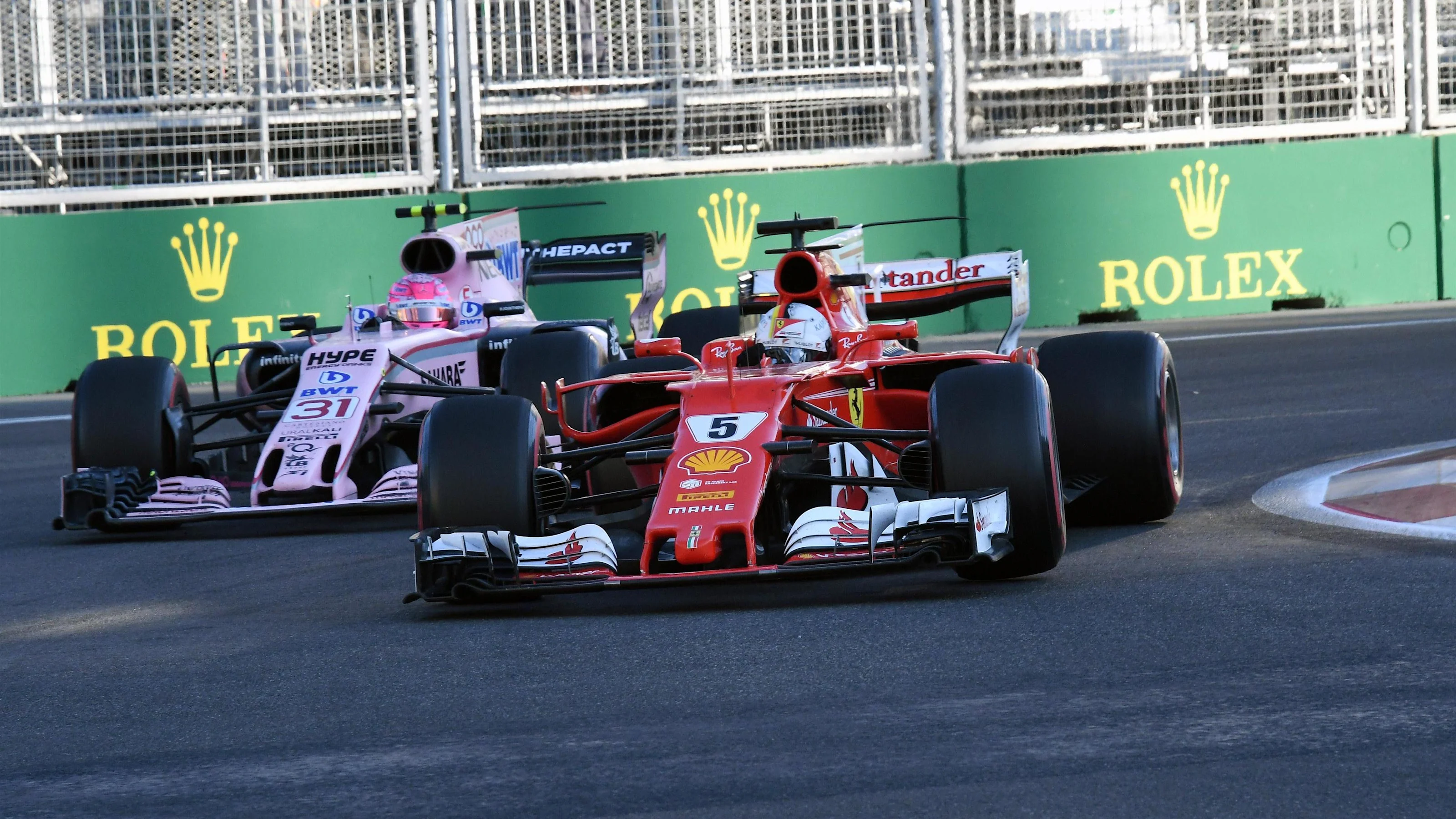 Sebastian Vettel (GER) Ferrari SF70-H and Esteban Ocon (FRA) Force India VJM10 at Formula One World