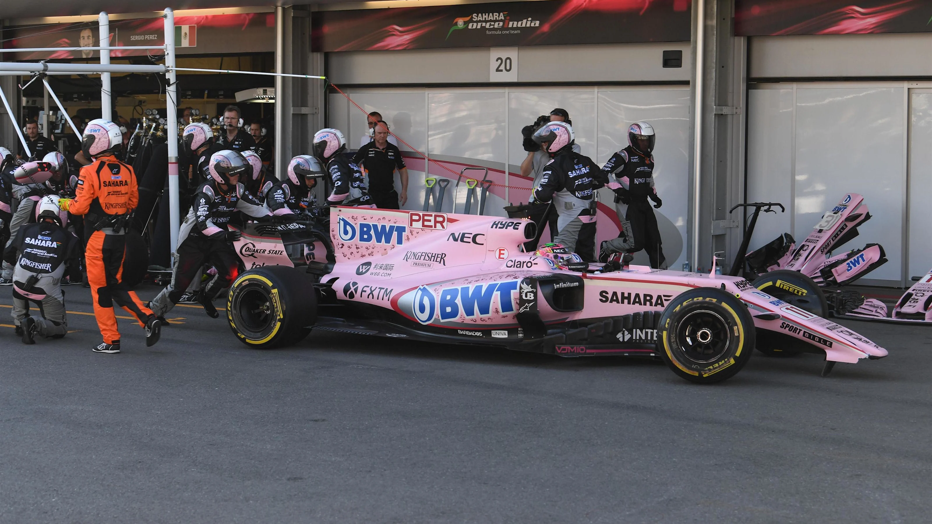 Sergio Perez (MEX) Force India VJM10 pits with a broken front wing at Formula One World