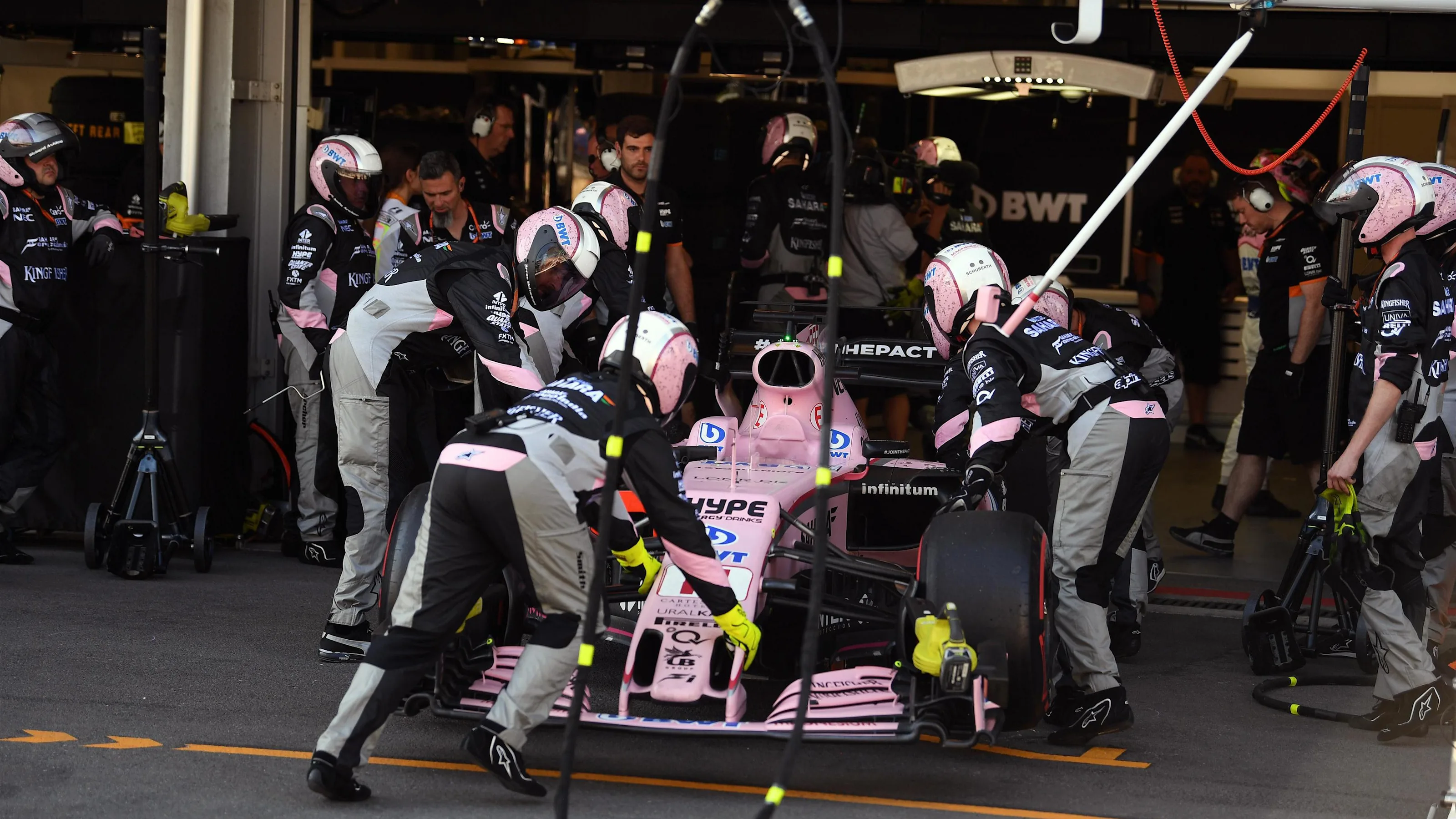 The car Sergio Perez (MEX) Force India VJM10 pits with a broken front wing and is pushed into the