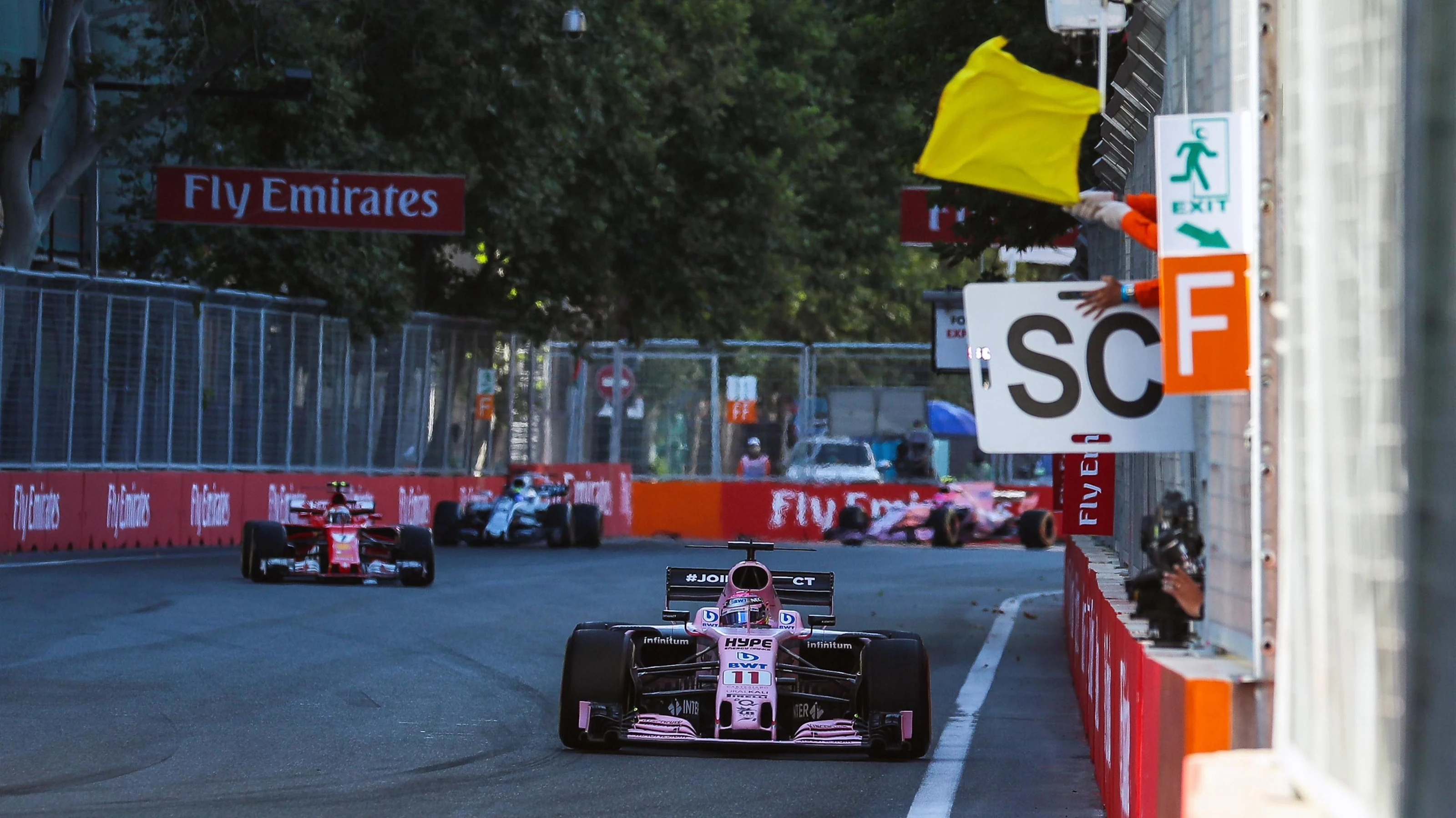 Sergio Perez (MEX) Force India VJM10 passes waved yellow flag and Safety Car board at Formula One