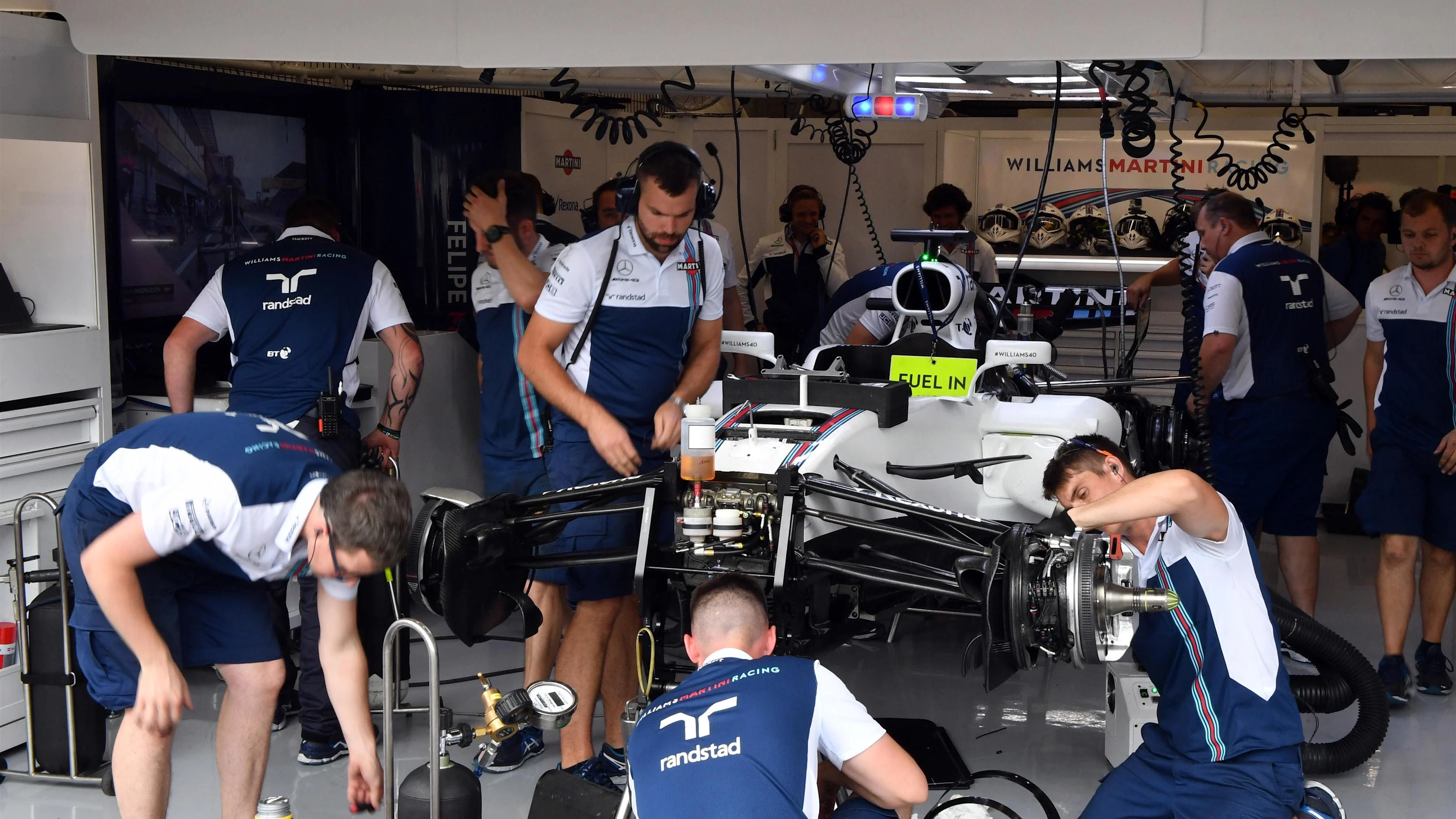 Mechanics work on the car of Felipe Massa (BRA) Williams FW40 in the garage at Formula One World