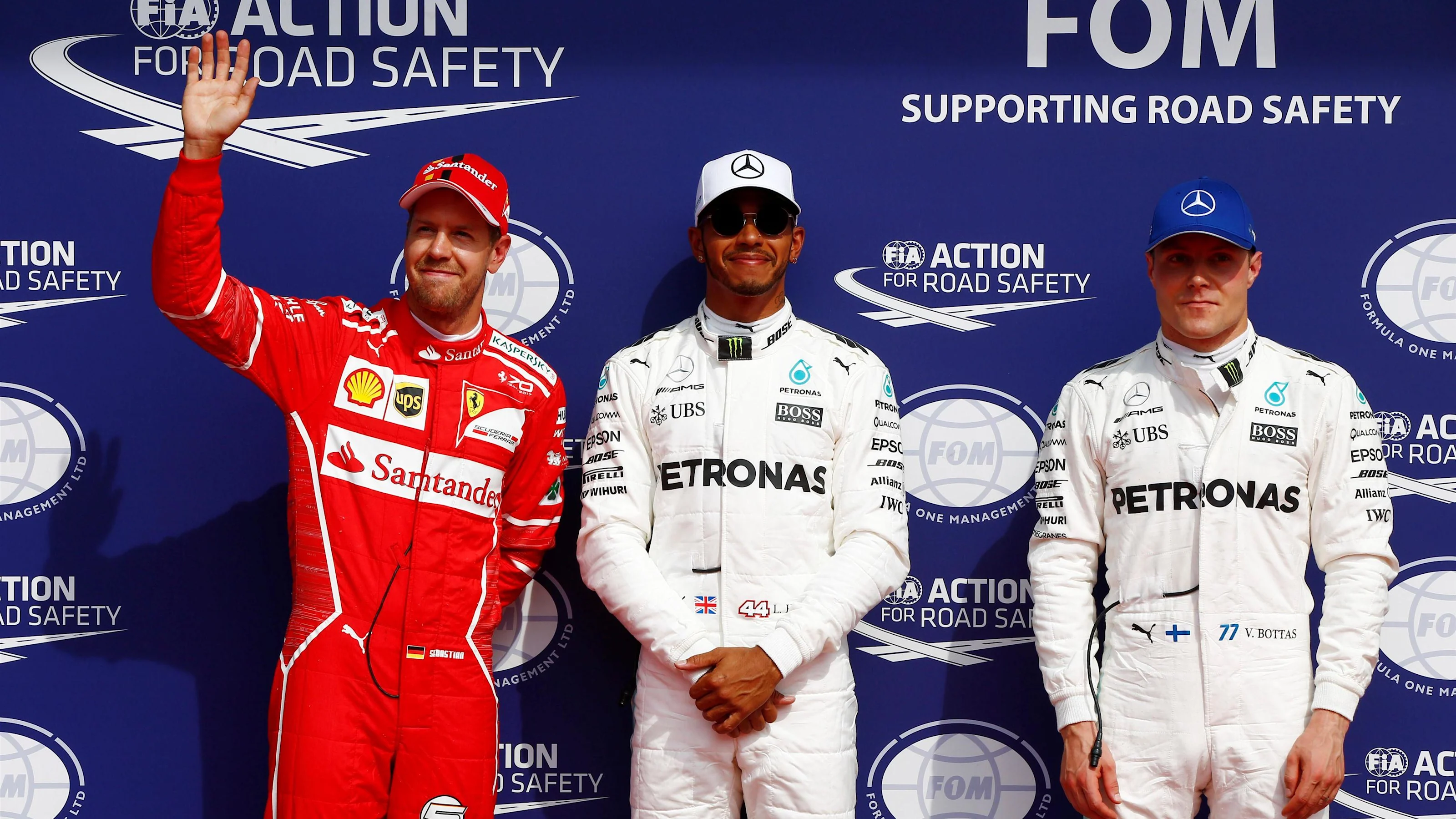 (L to R): Sebastian Vettel (GER) Ferrari, pole sitter Lewis Hamilton (GBR) Mercedes AMG F1 and