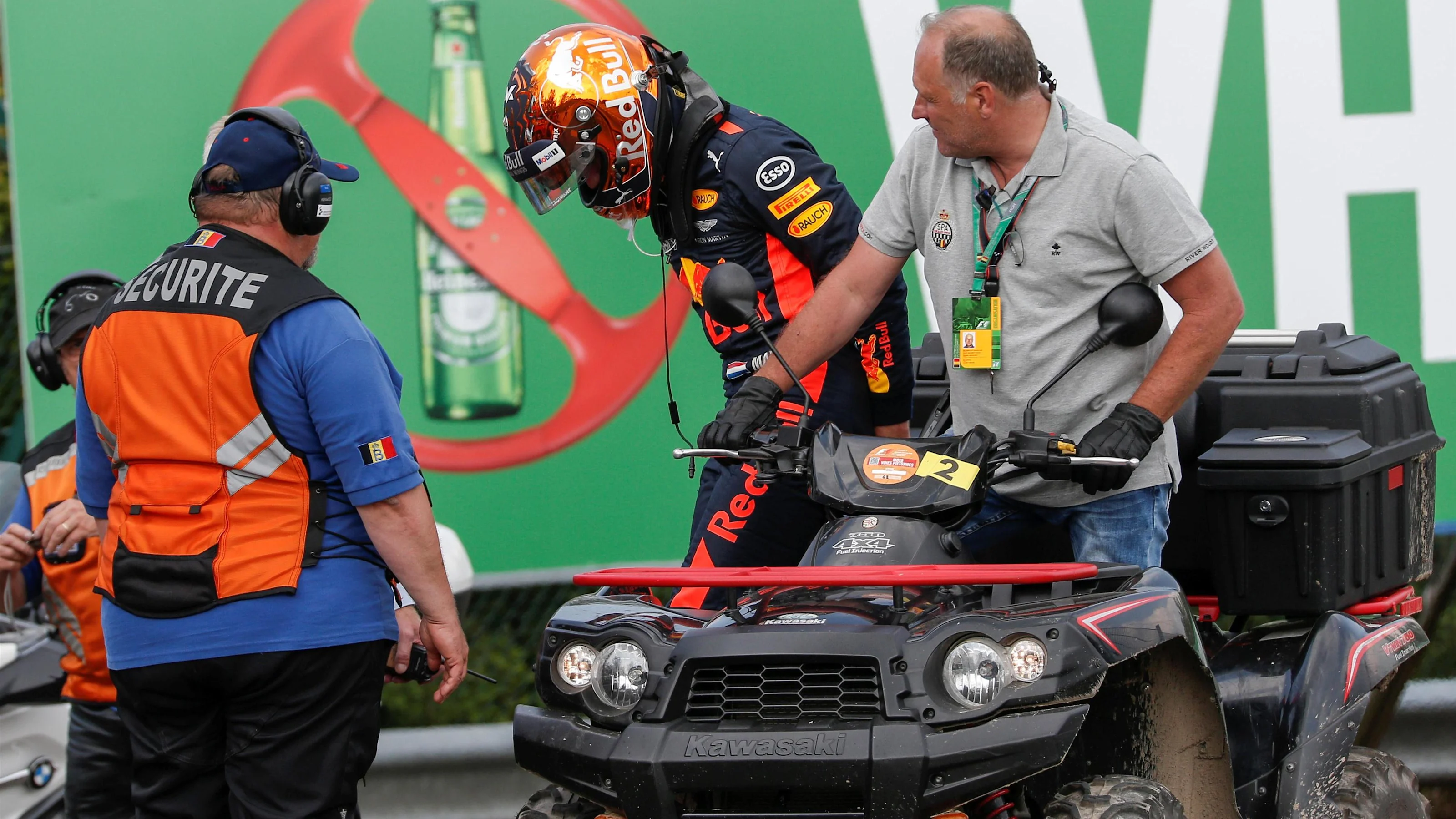 Race retiree Max Verstappen (NED) Red Bull Racing with Race Marshals and Security after stopping on
