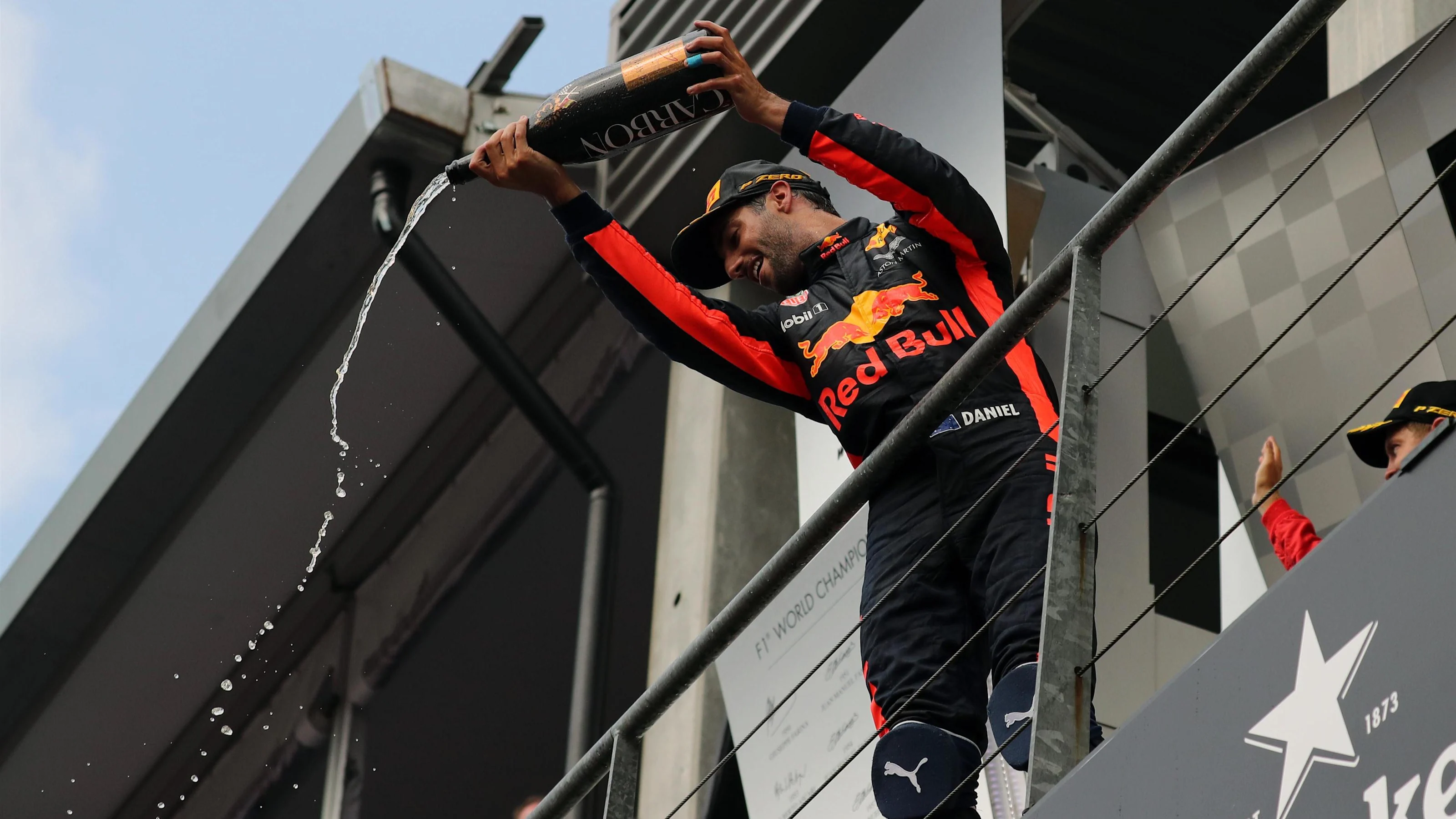 Daniel Ricciardo (AUS) Red Bull Racing celebrates on the podium with the champagne at Formula One