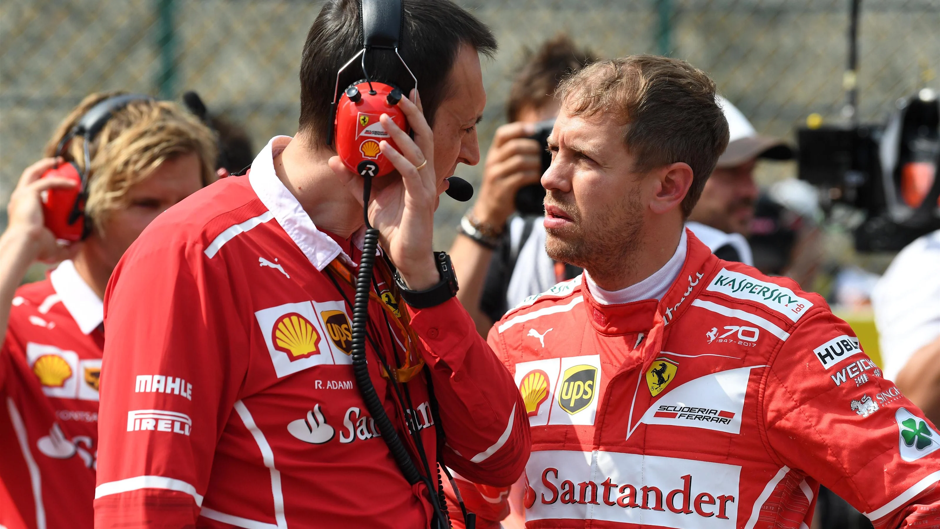 Adami (ITA) Ferrari Race Engineer and Sebastian Vettel (GER) Ferrari on the grid at Formula One