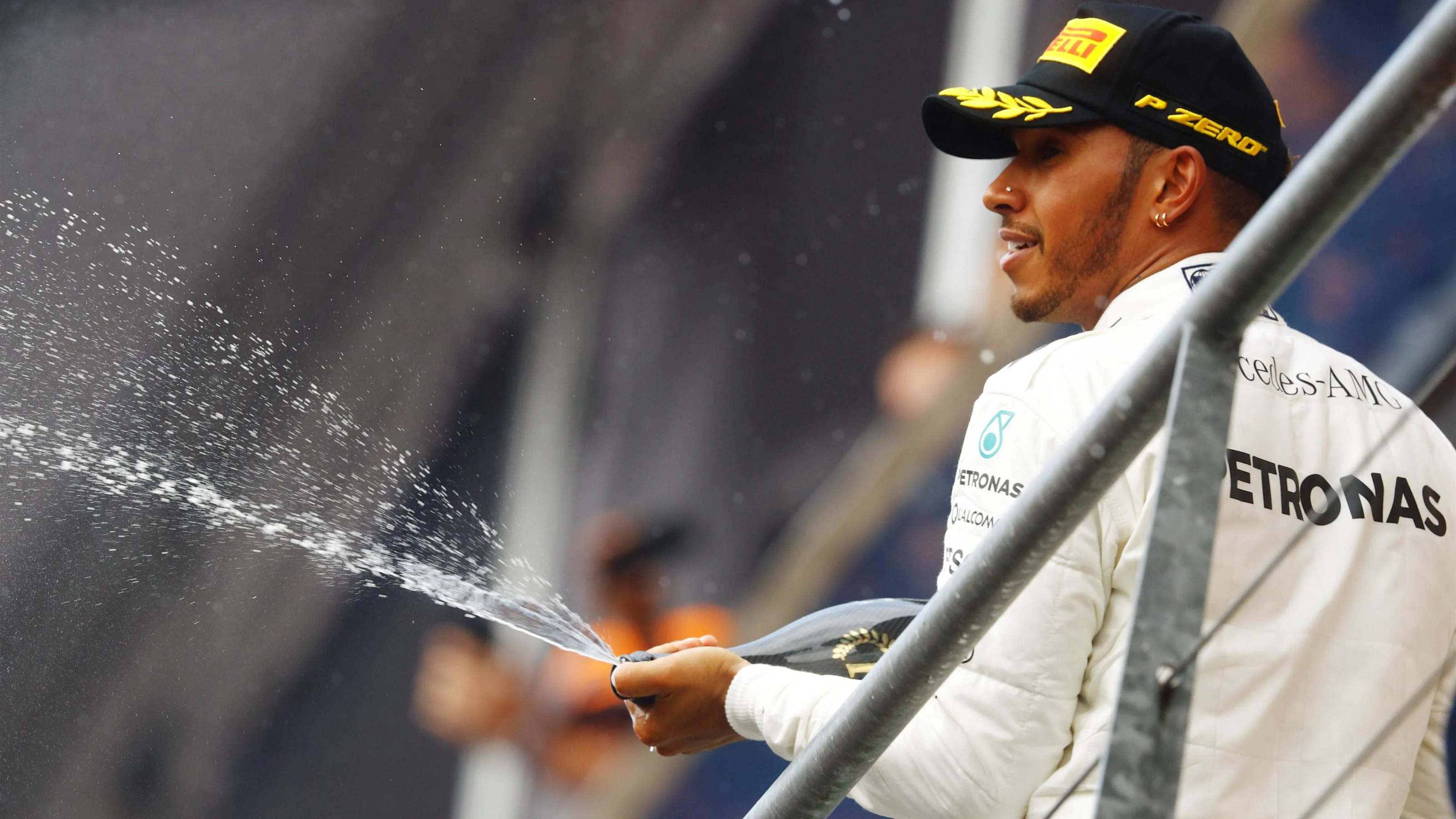 Race winner Lewis Hamilton (GBR) Mercedes AMG F1 celebrates on the podium with the champagne