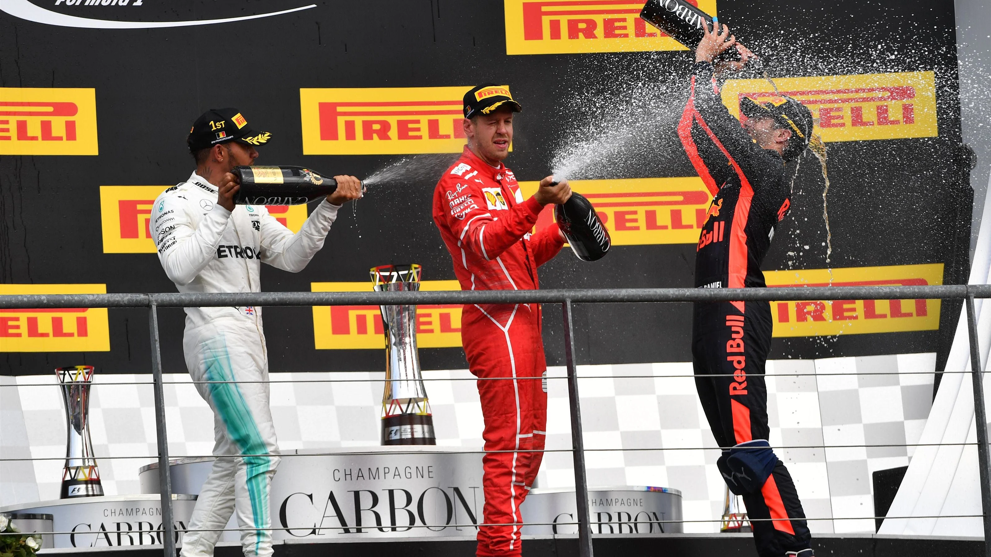 Race winner Lewis Hamilton (GBR) Mercedes AMG F1 celebrates on the podium with Sebastian Vettel