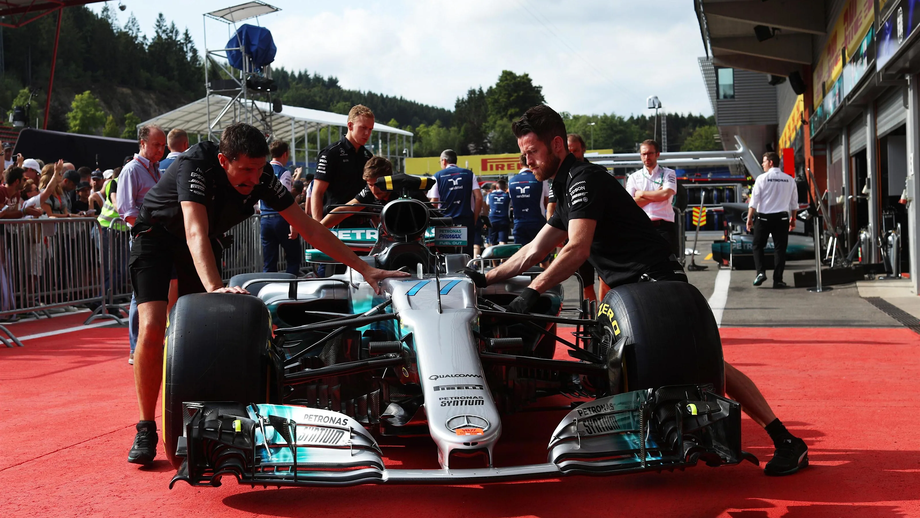 Mercedes AMG F1 mechanics with Mercedes-Benz F1 W08 Hybrid in pit lane at Formula One World