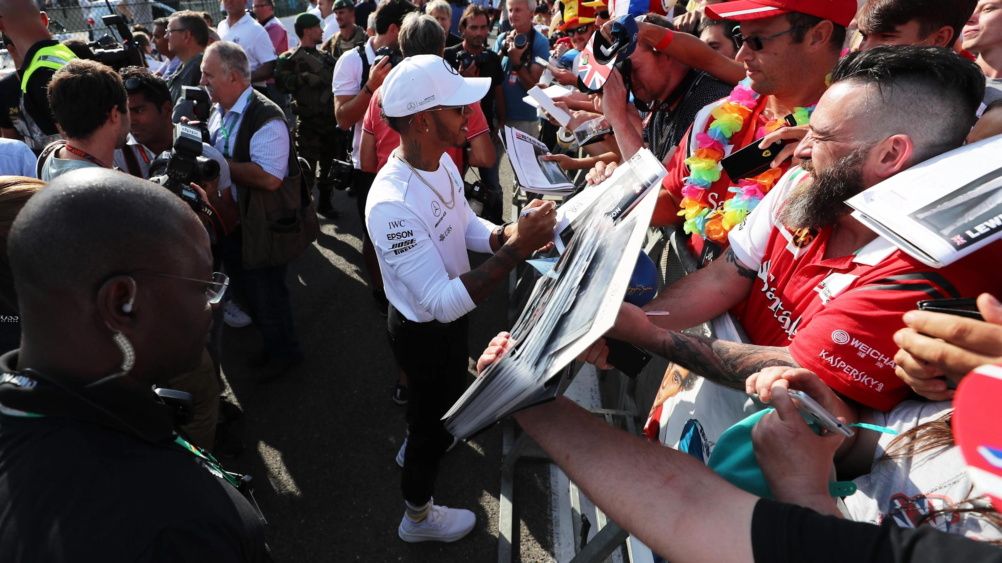 Lewis Hamilton (GBR) Mercedes AMG F1 signs autographs for the fans at Formula One World
