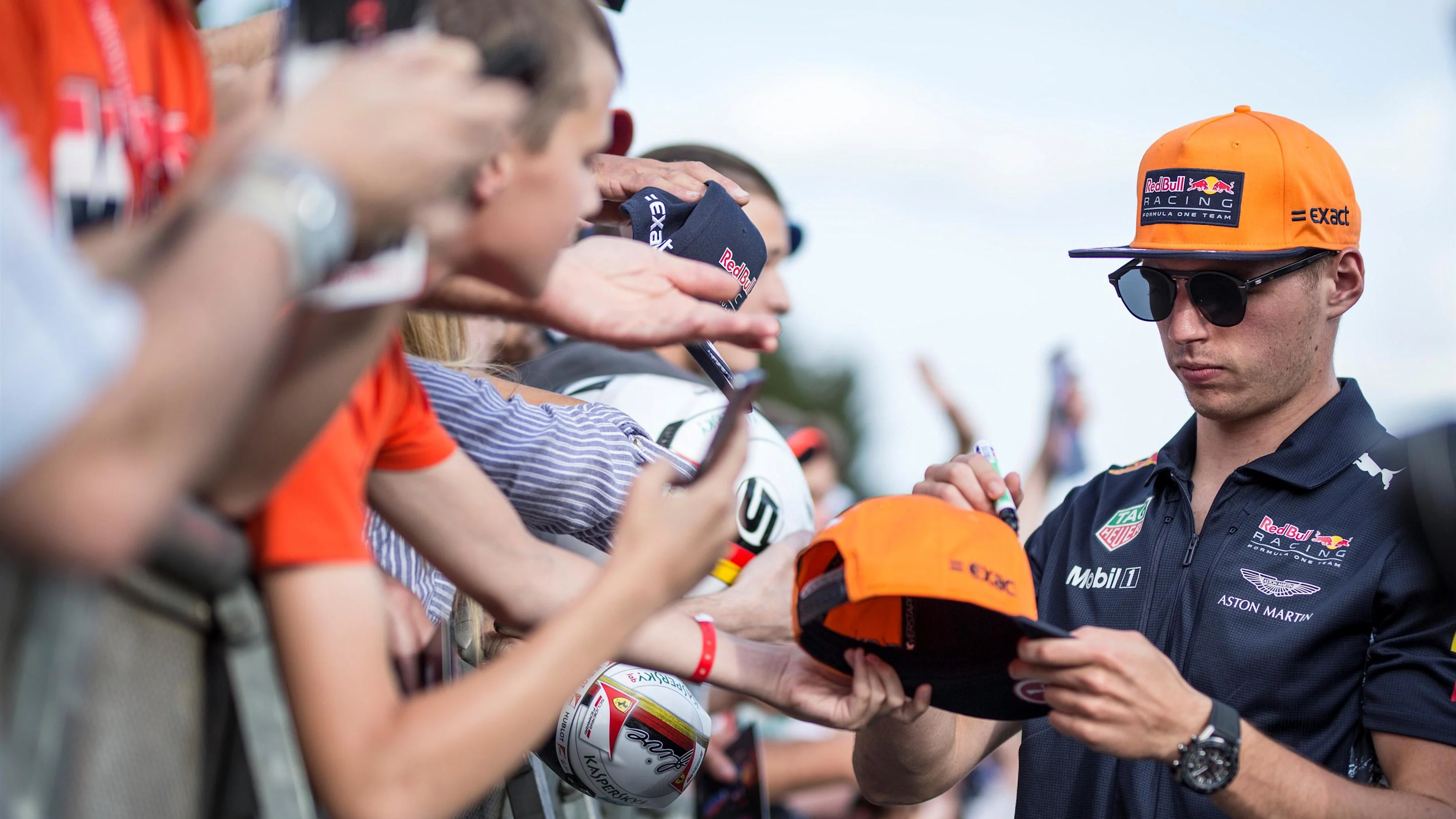 Max Verstappen (NED) Red Bull Racing signs autographs for the fans at Formula One World