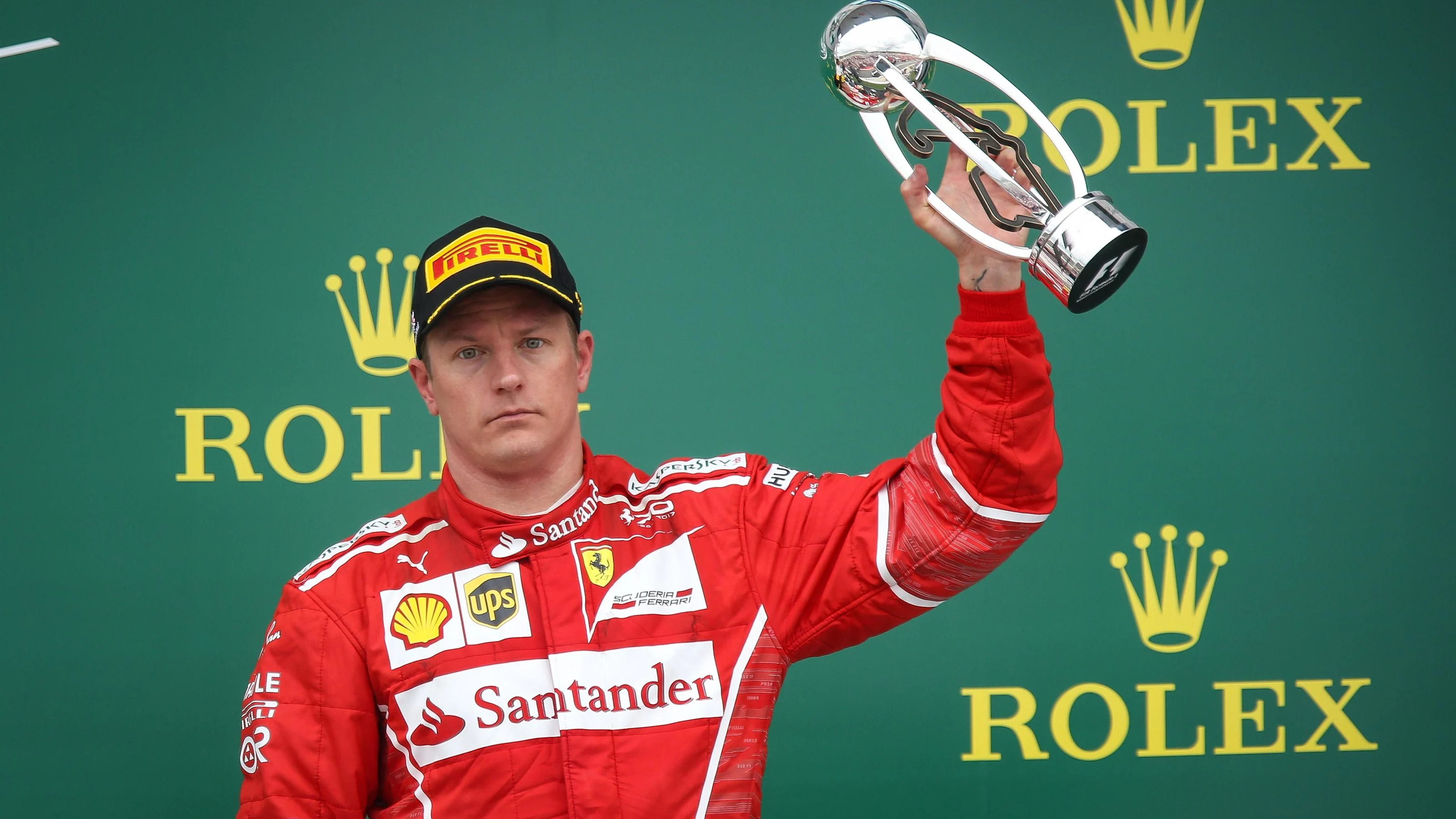Kimi Raikkonen (FIN) Ferrari celebrates on the podium with the trophy at Formula One World
