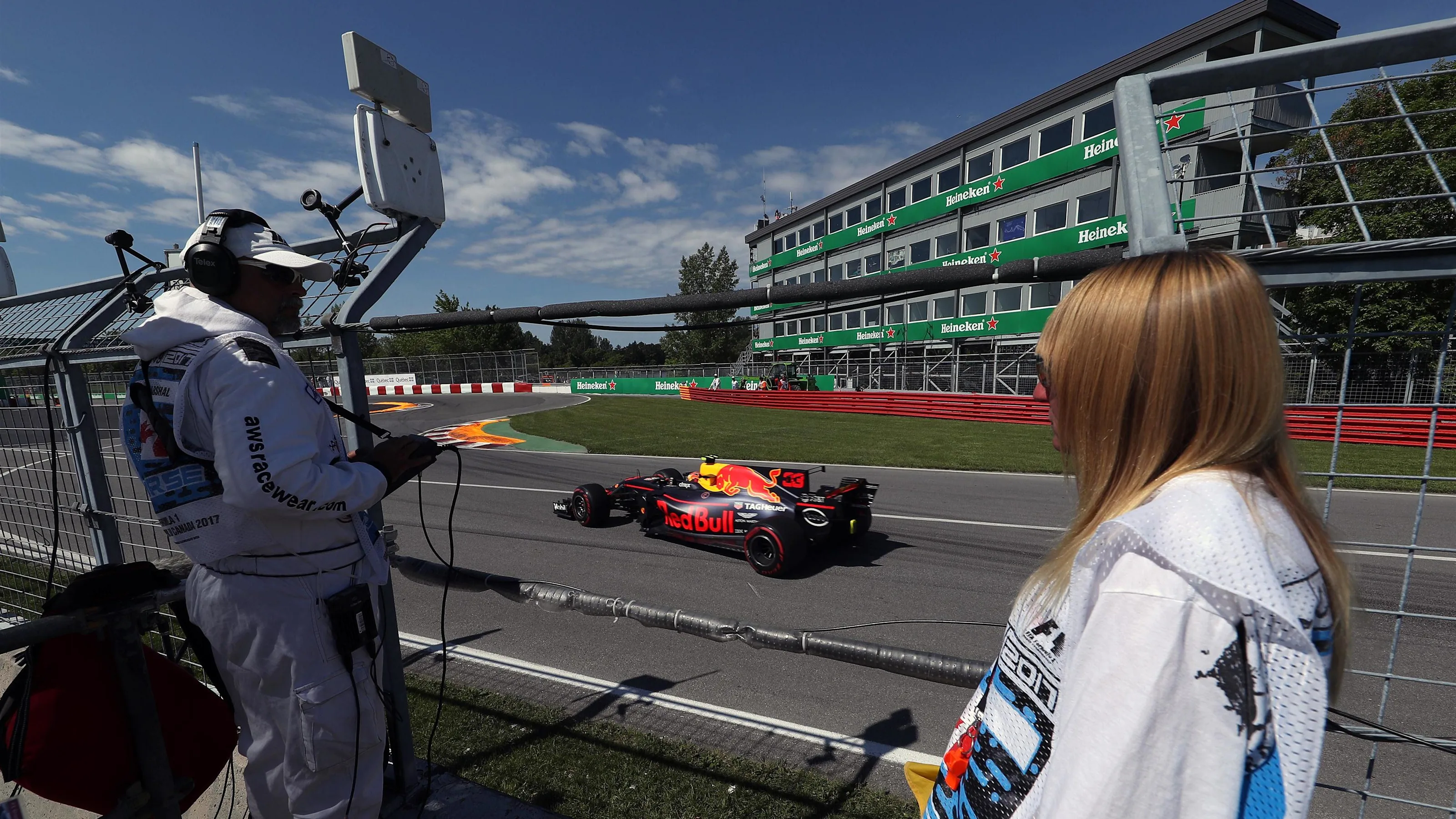 Marshals observe Max Verstappen (NED) Red Bull Racing RB13 at Formula One World Championship, Rd7,