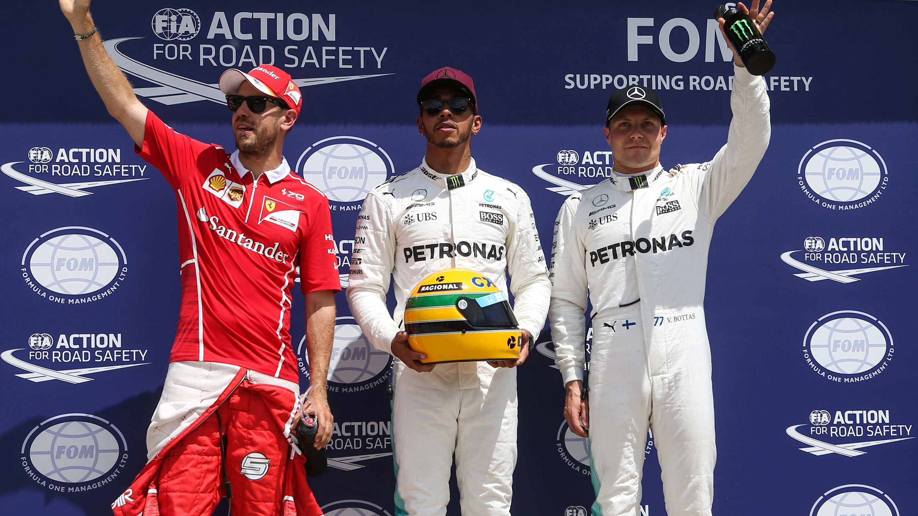 (L to R): Sebastian Vettel (GER) Ferrari, pole sitter Lewis Hamilton (GBR) Mercedes AMG F1 and