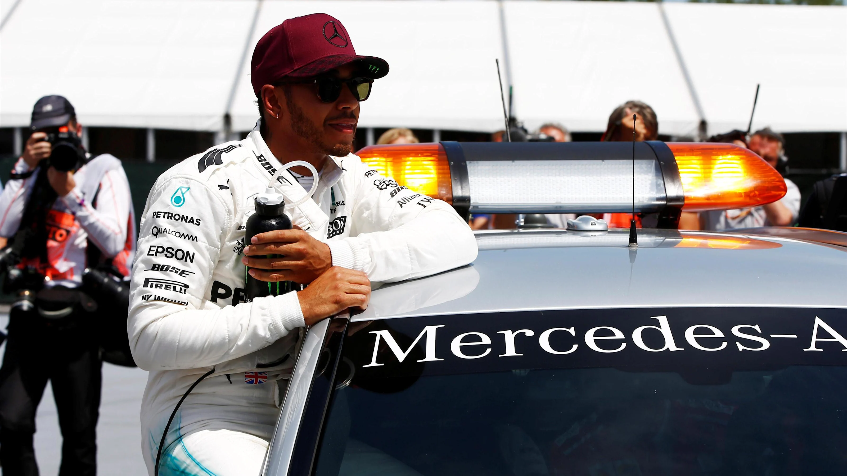 Pole sitter Lewis Hamilton (GBR) Mercedes AMG F1 on the Medical Car at Formula One World