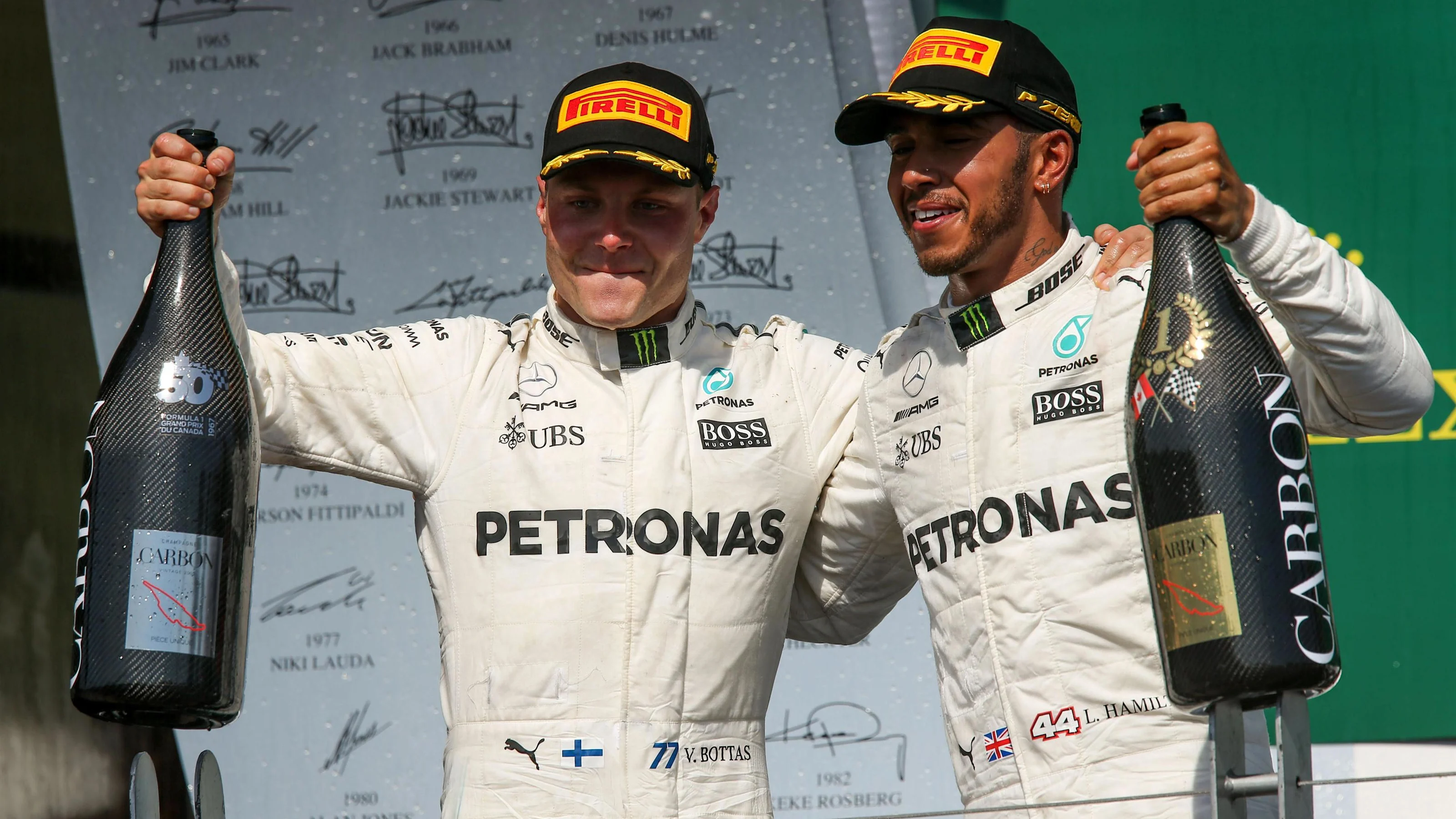 Valtteri Bottas (FIN) Mercedes AMG F1 celebrates on the podium with the champagne alongside race