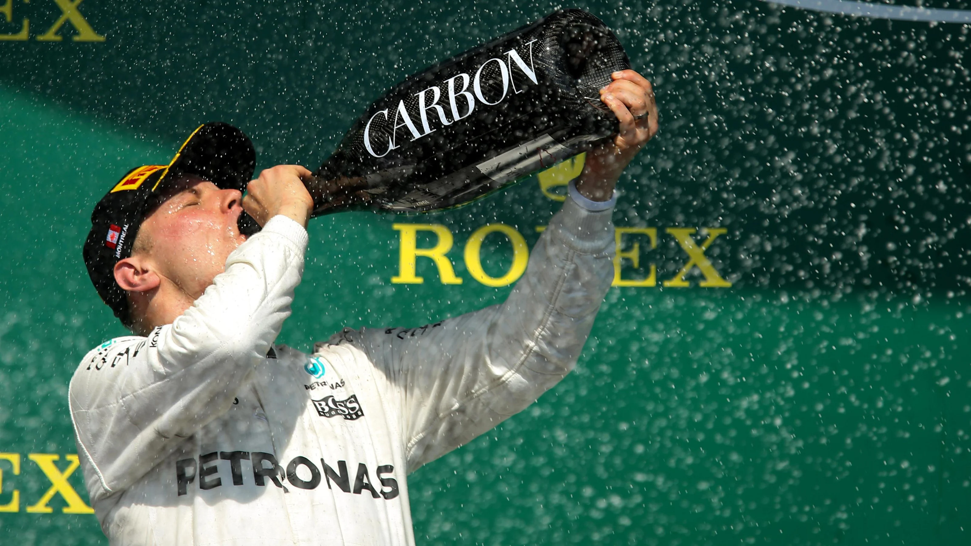 Valtteri Bottas (FIN) Mercedes AMG F1 celebrates on the podium with the champagne at Formula One