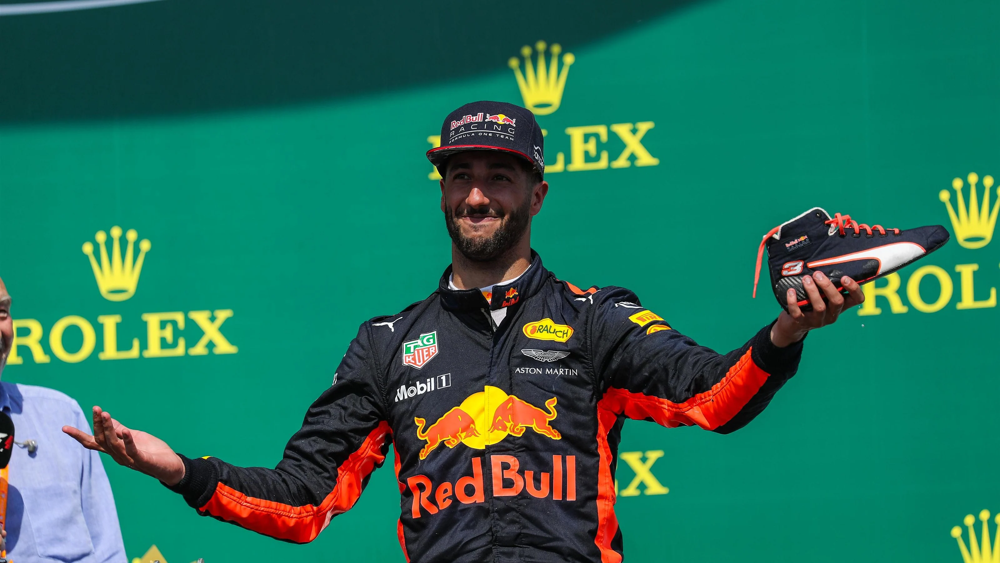 Daniel Ricciardo (AUS) Red Bull Racing celebrates on the podium and does a shoey at Formula One