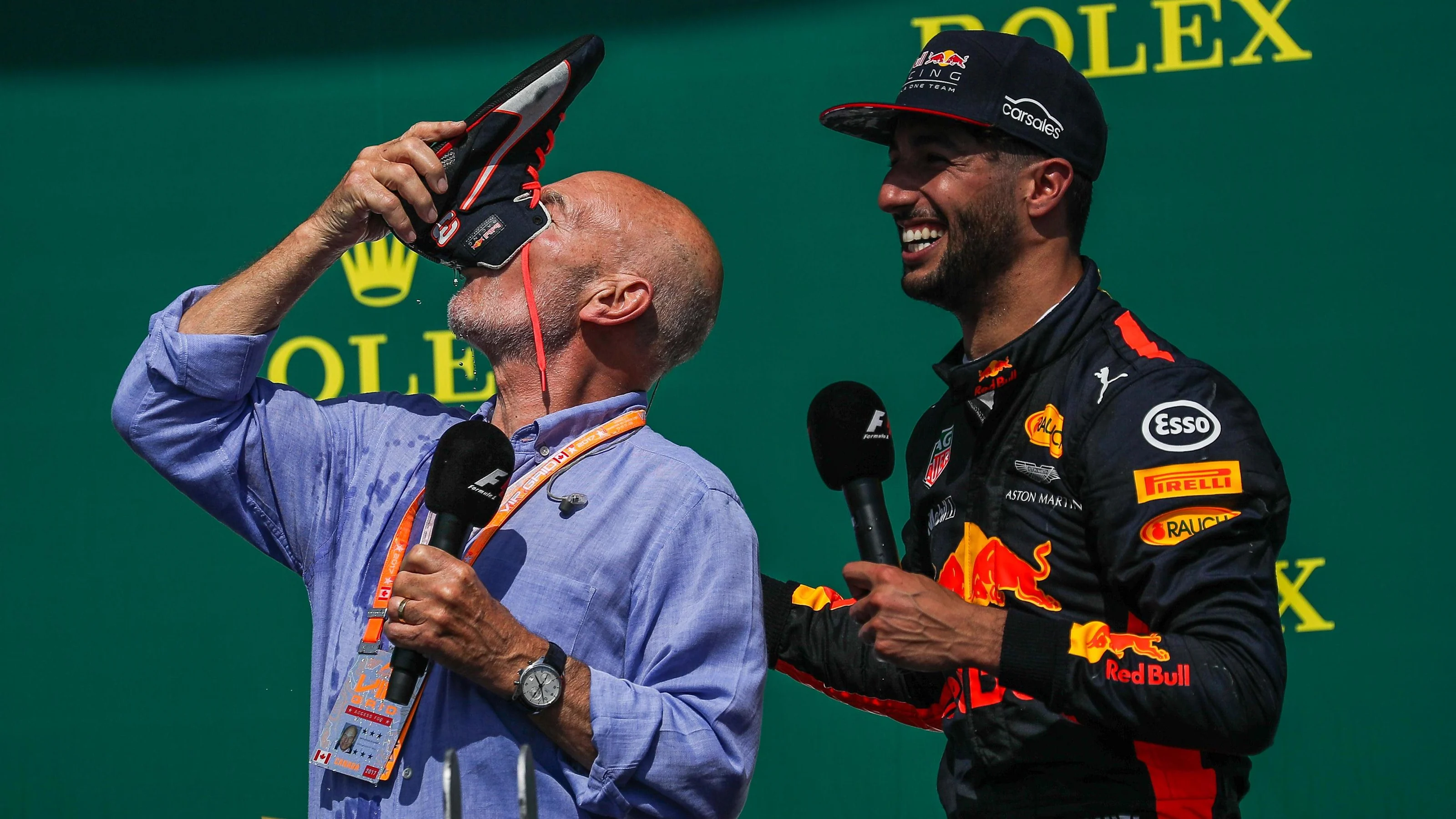 Patrick Stewart (GBR) celebrates and does a shoey on the podium watched by Daniel Ricciardo (AUS)