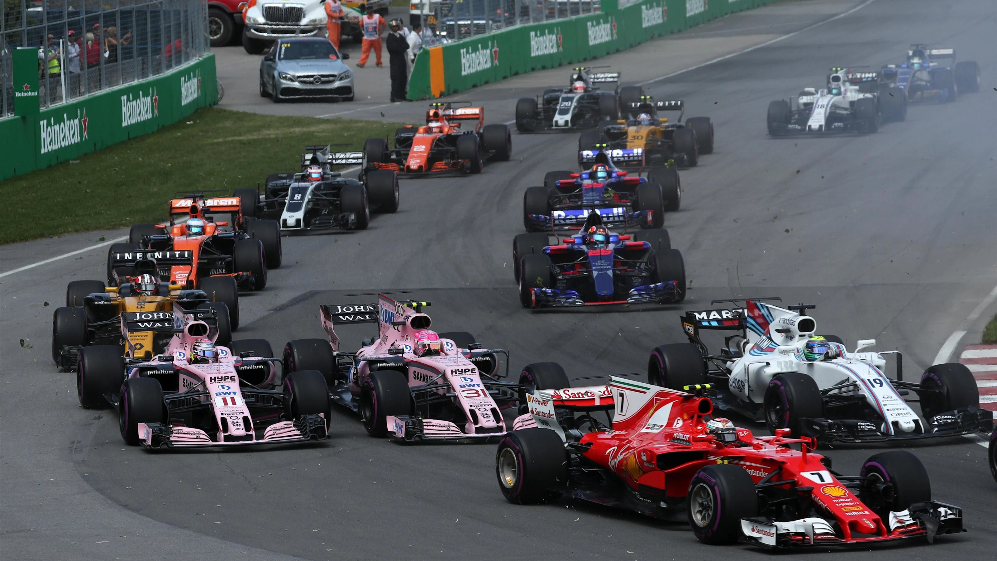 Kimi Raikkonen (FIN) Ferrari SF70-H, Sergio Perez (MEX) Force India VJM10 and Esteban Ocon (FRA)