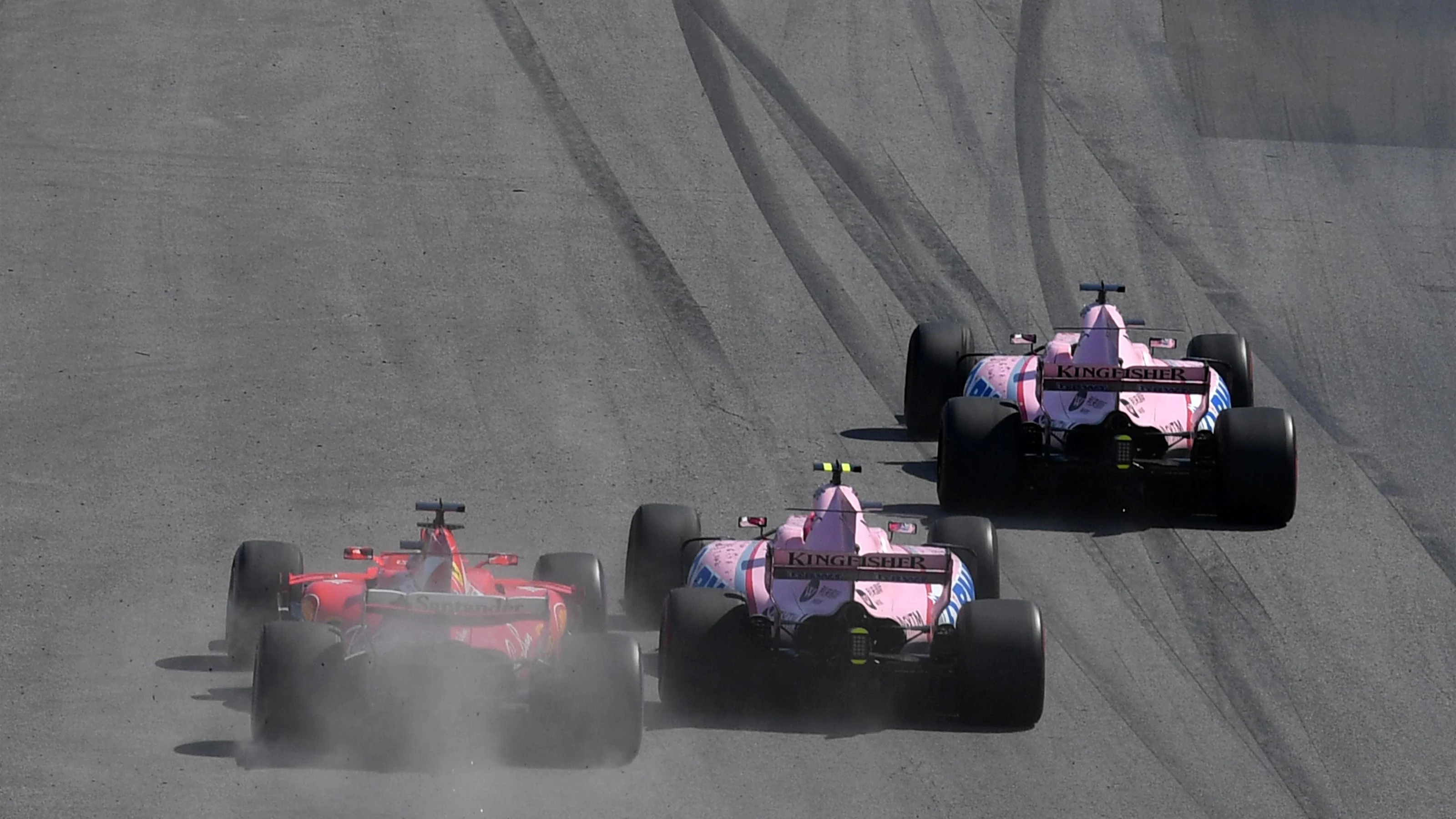 Sergio Perez (MEX) Force India VJM10, Esteban Ocon (FRA) Force India VJM10 and Sebastian Vettel