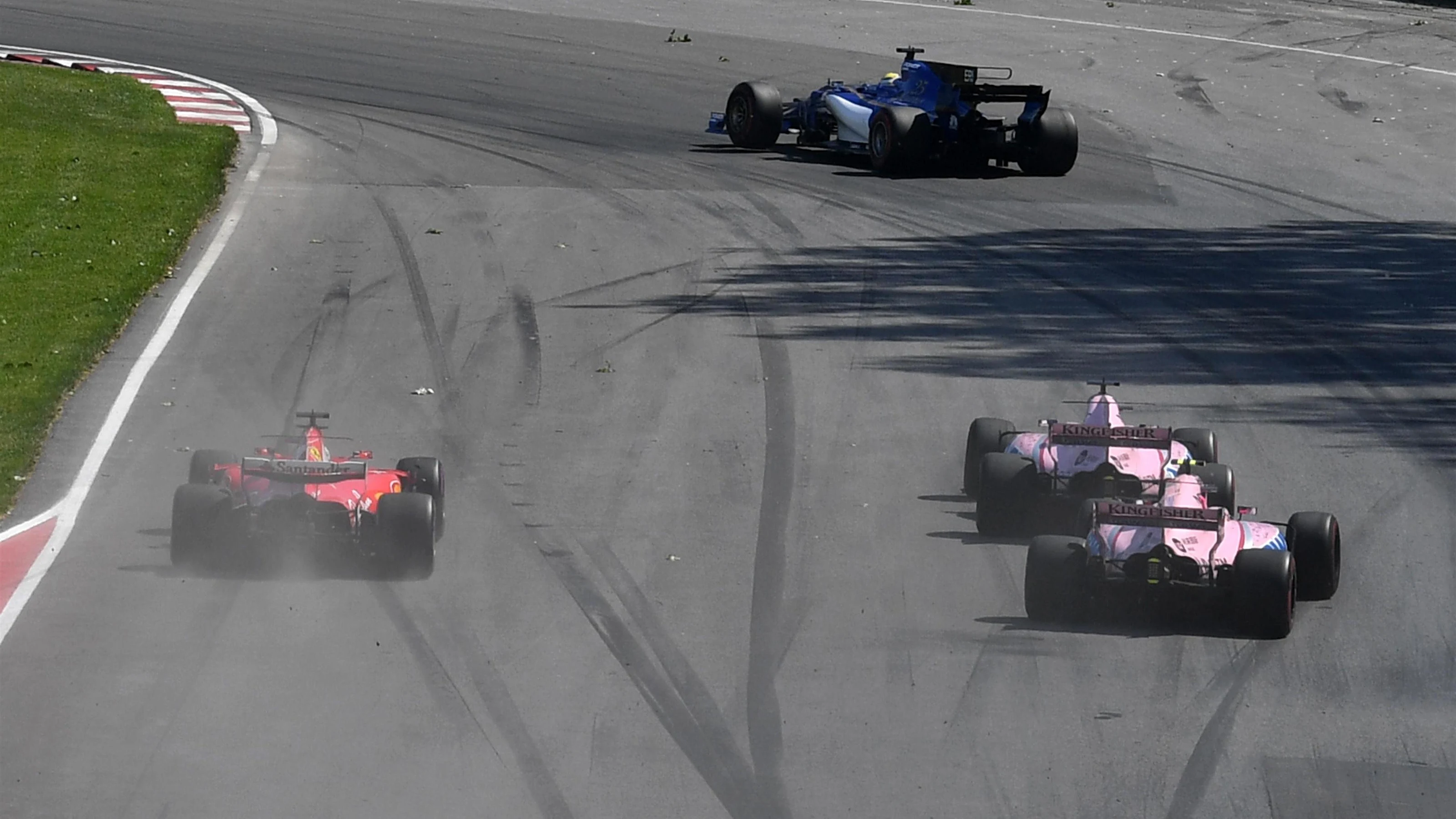 Sergio Perez (MEX) Force India VJM10, Esteban Ocon (FRA) Force India VJM10 and Sebastian Vettel