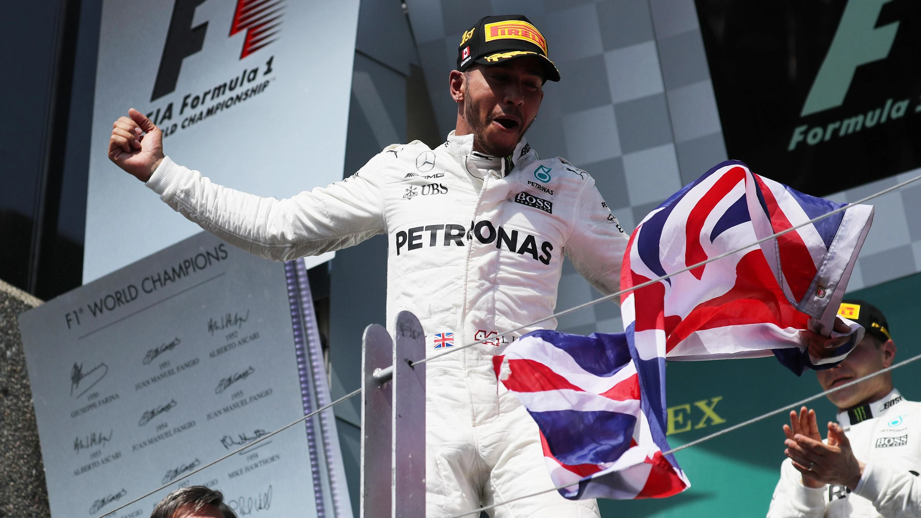 Race winner Lewis Hamilton (GBR) Mercedes AMG F1 celebrates  on the podium at Formula One World