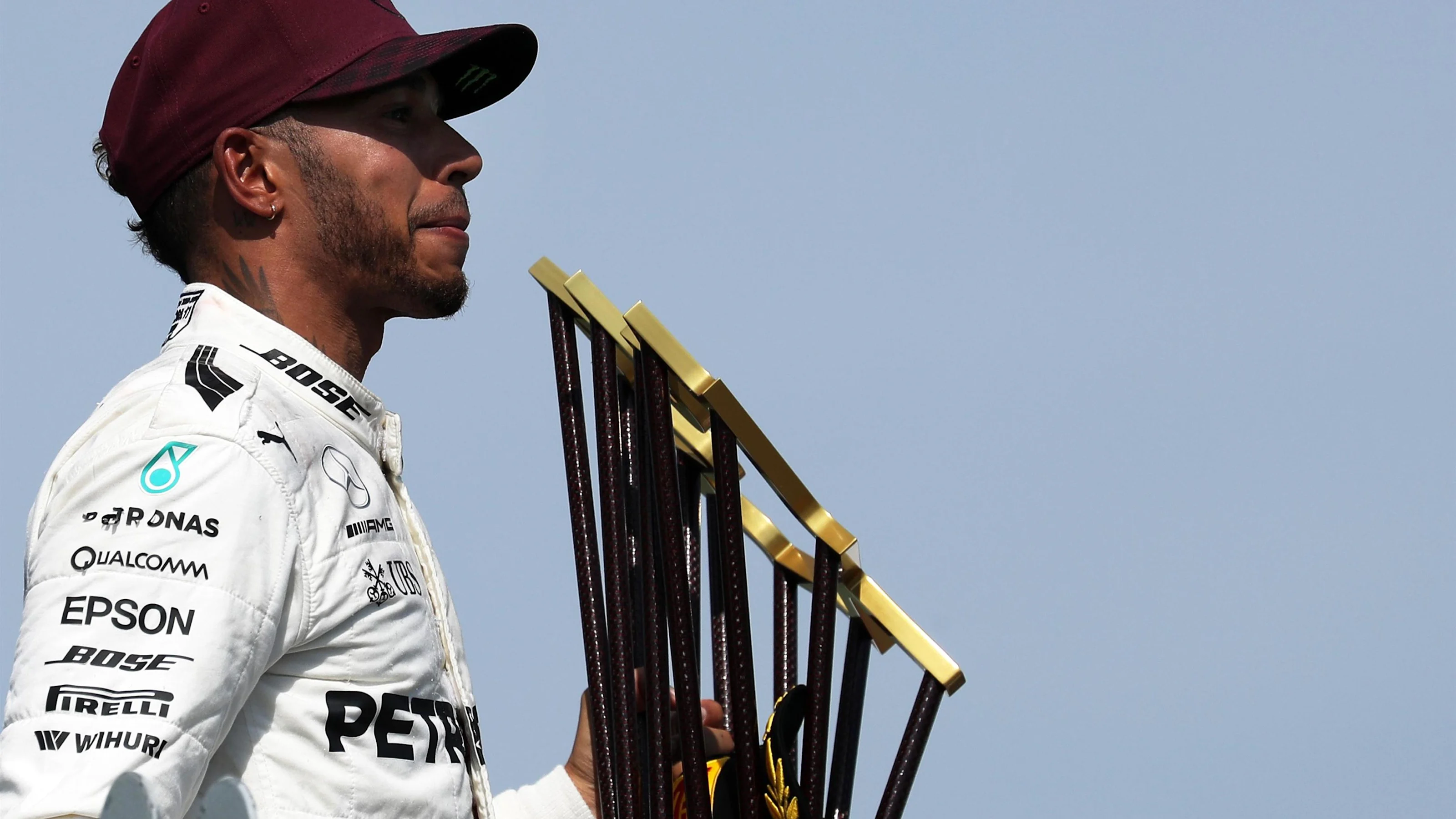 Race winner Lewis Hamilton (GBR) Mercedes AMG F1 celebrateson the podium with the trophy at Formula