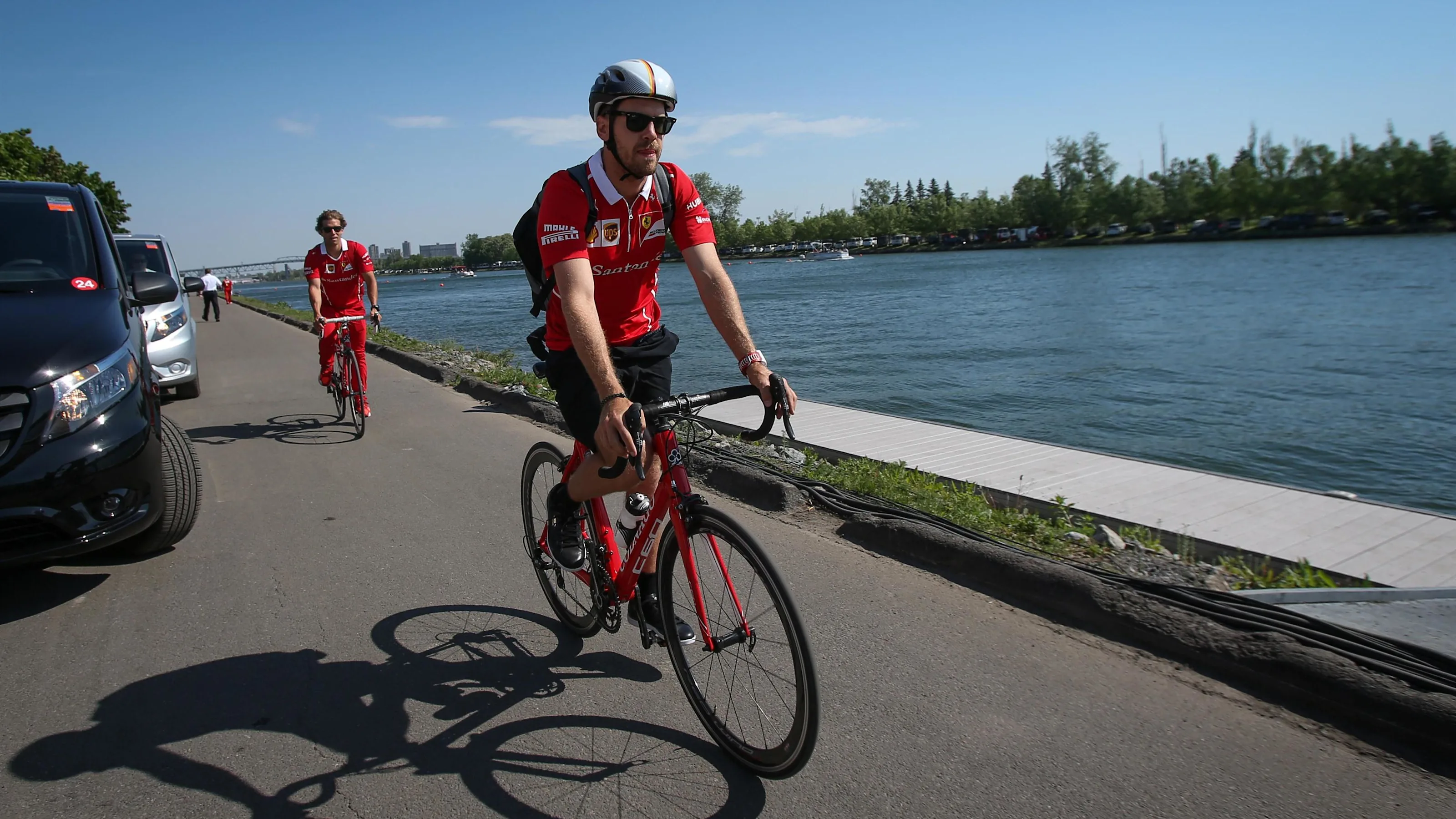 Sebastian Vettel (GER) Ferrari SF70-H arrives on a bike at Formula One World Championship, Rd7,