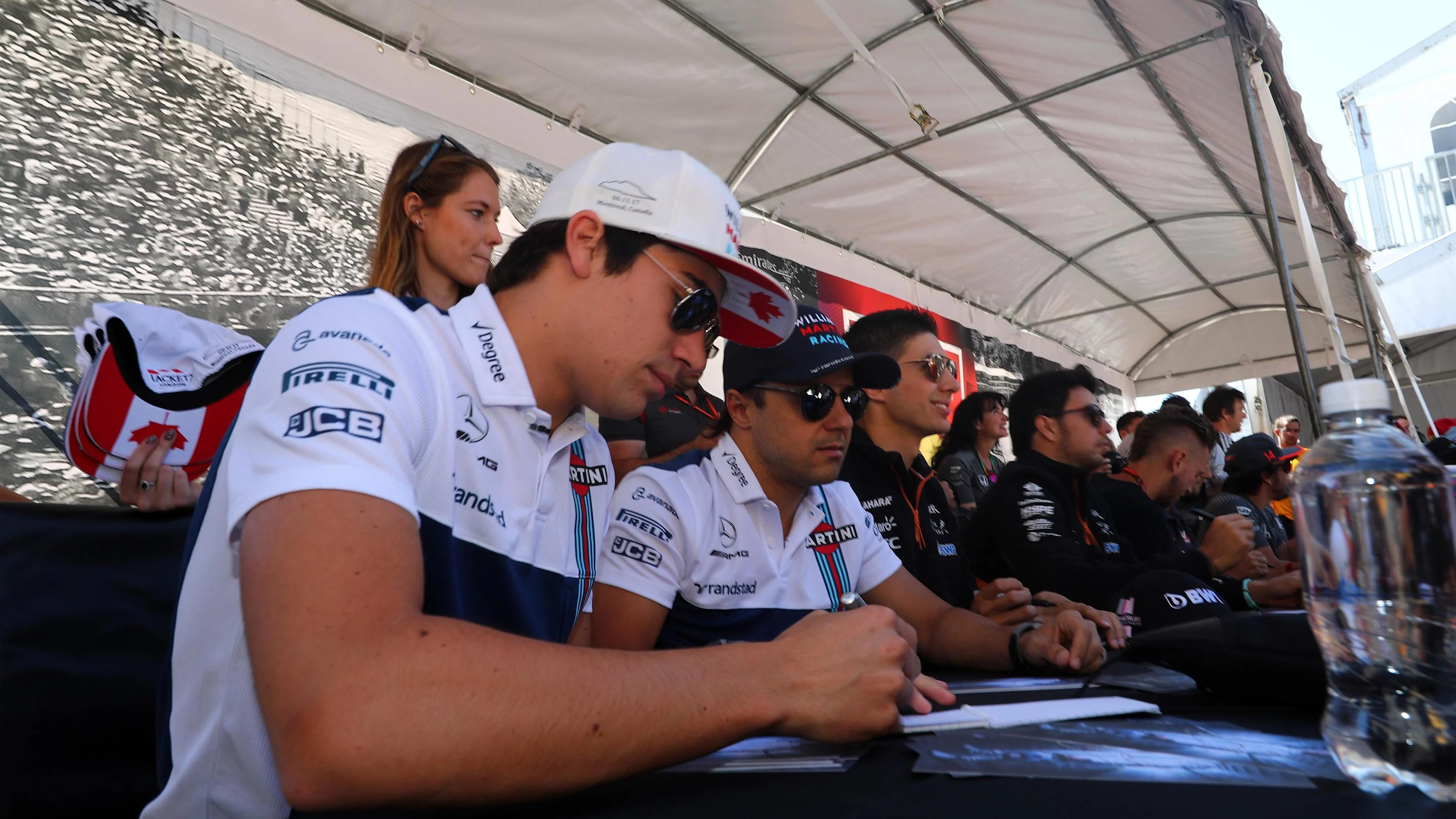 Lance Stroll (CDN) Williams and Felipe Massa (BRA) Williams sign autographs for the fans at Formula