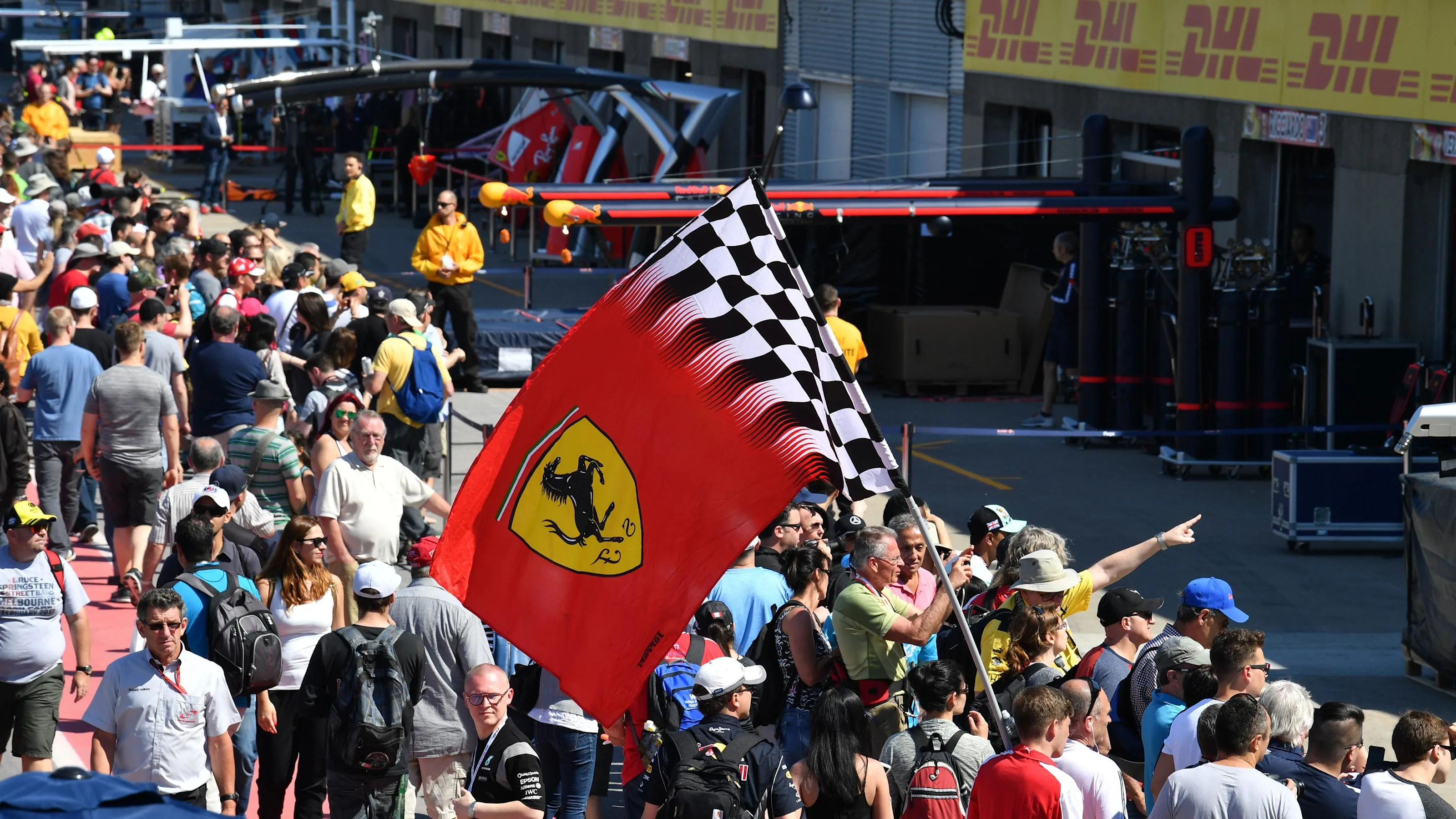 Fans and Ferrari flag in pit lane at Formula One World Championship, Rd7, Canadian Grand Prix,