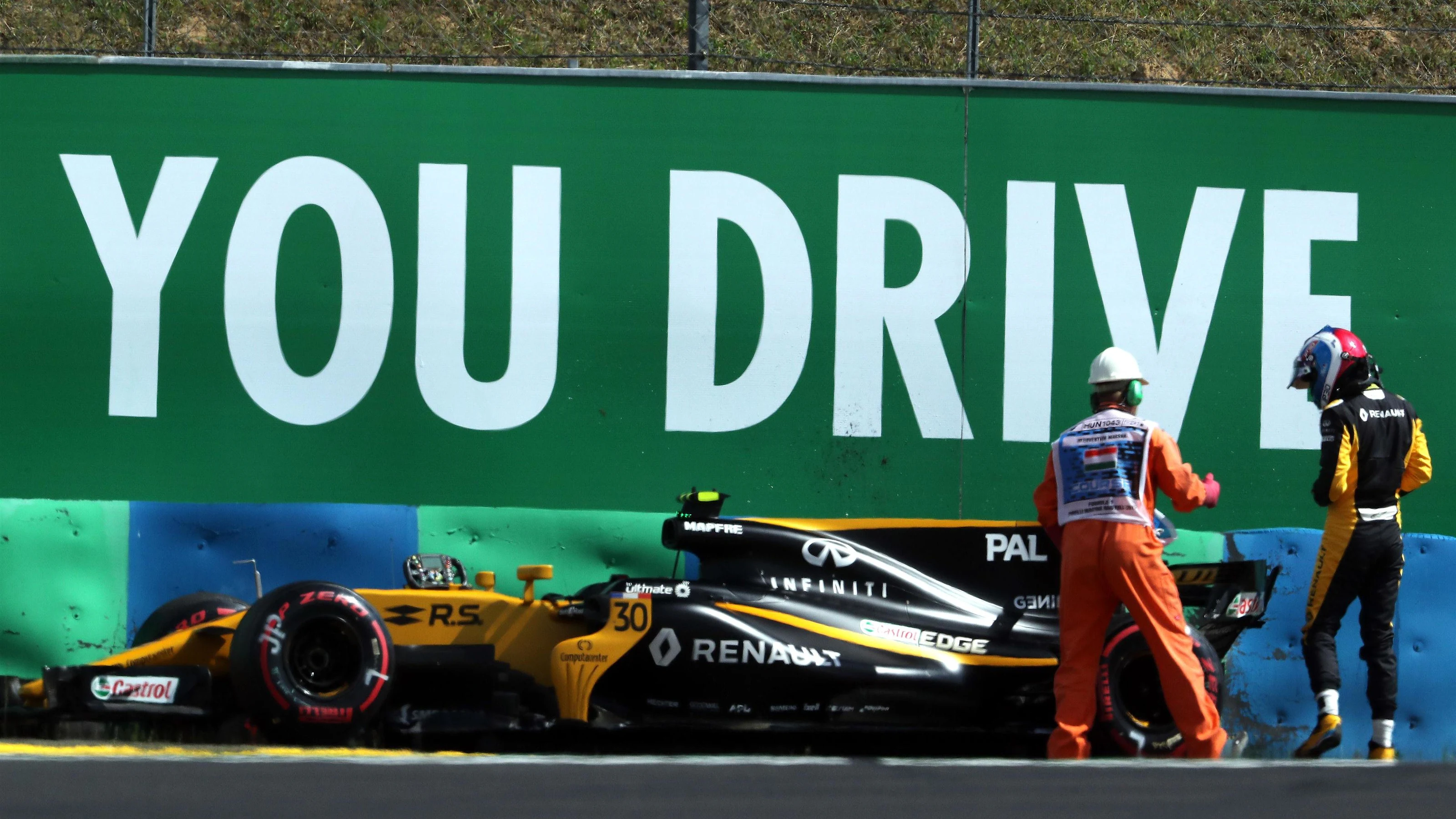 Marshal and the crashed car of Jolyon Palmer (GBR) Renault Sport F1 Team RS17 in FP2 at Formula One