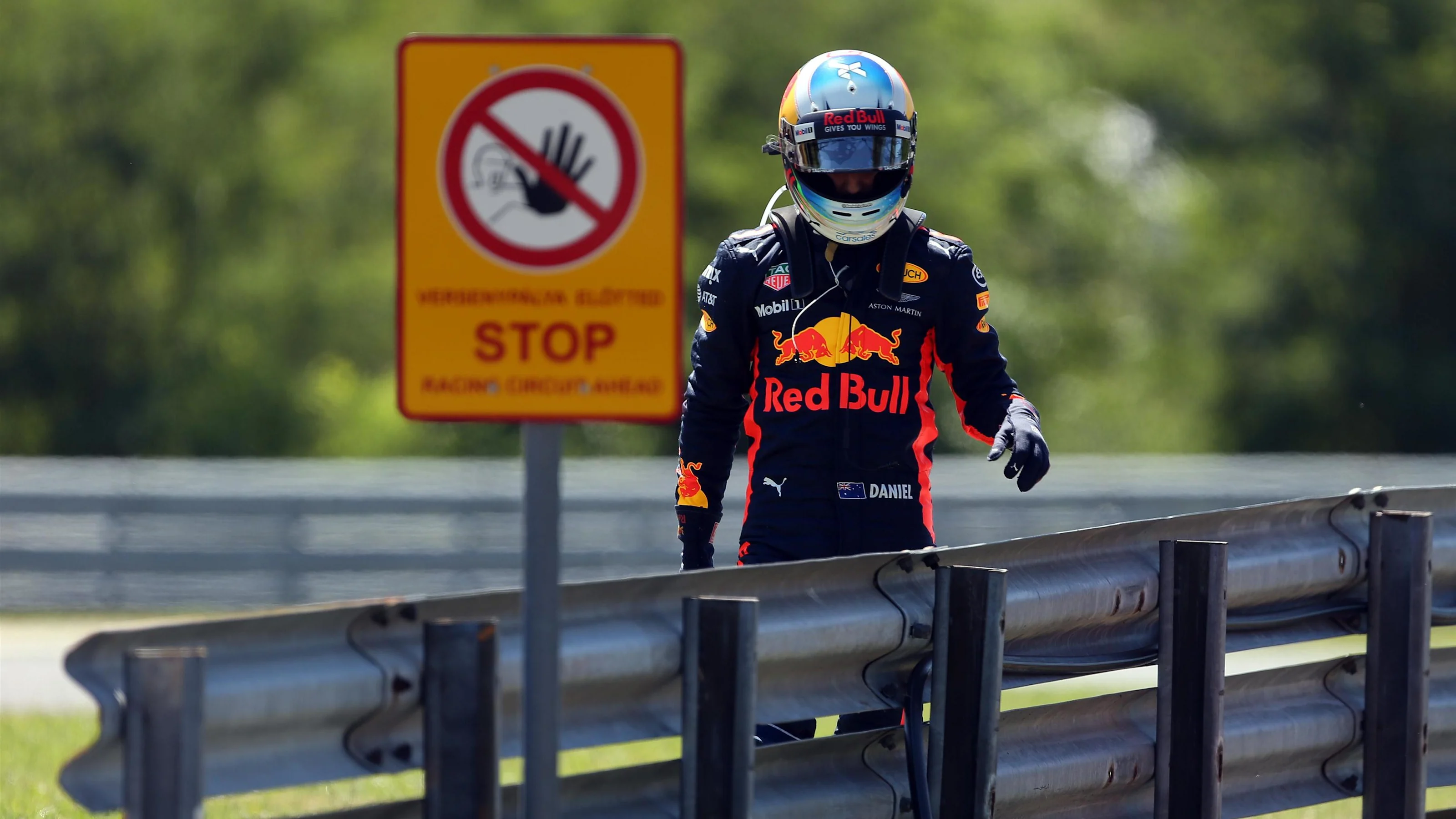 Daniel Ricciardo (AUS) Red Bull Racing walks on track after stopping on track in FP3 at Formula One
