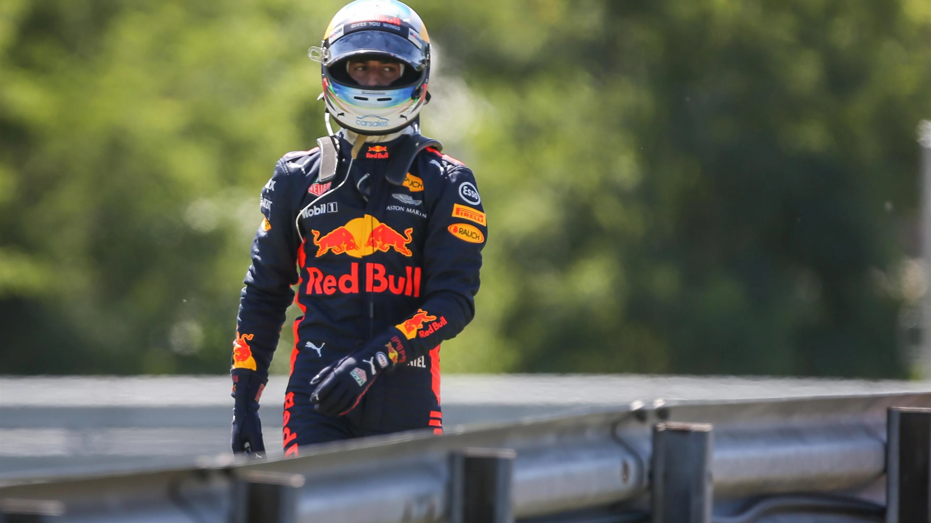 Daniel Ricciardo (AUS) Red Bull Racing walks on track after stopping on track in FP3 at Formula One