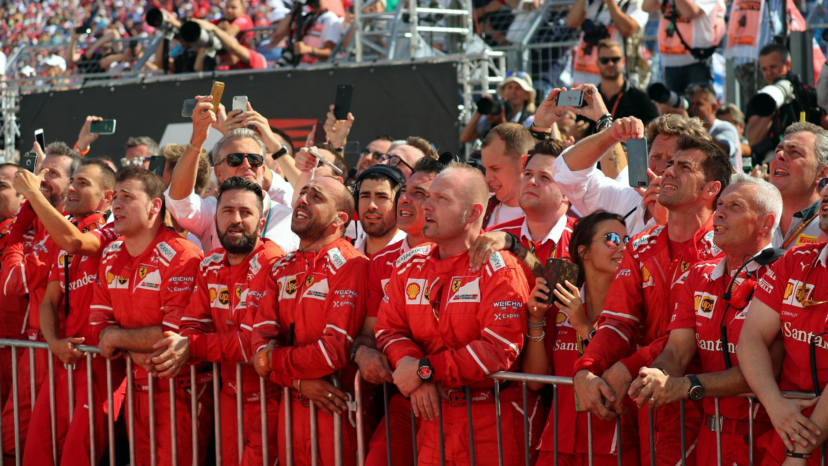 The Ferrari team celebrate in parc ferme at Formula One World Championship, Rd11, Hungarian Grand