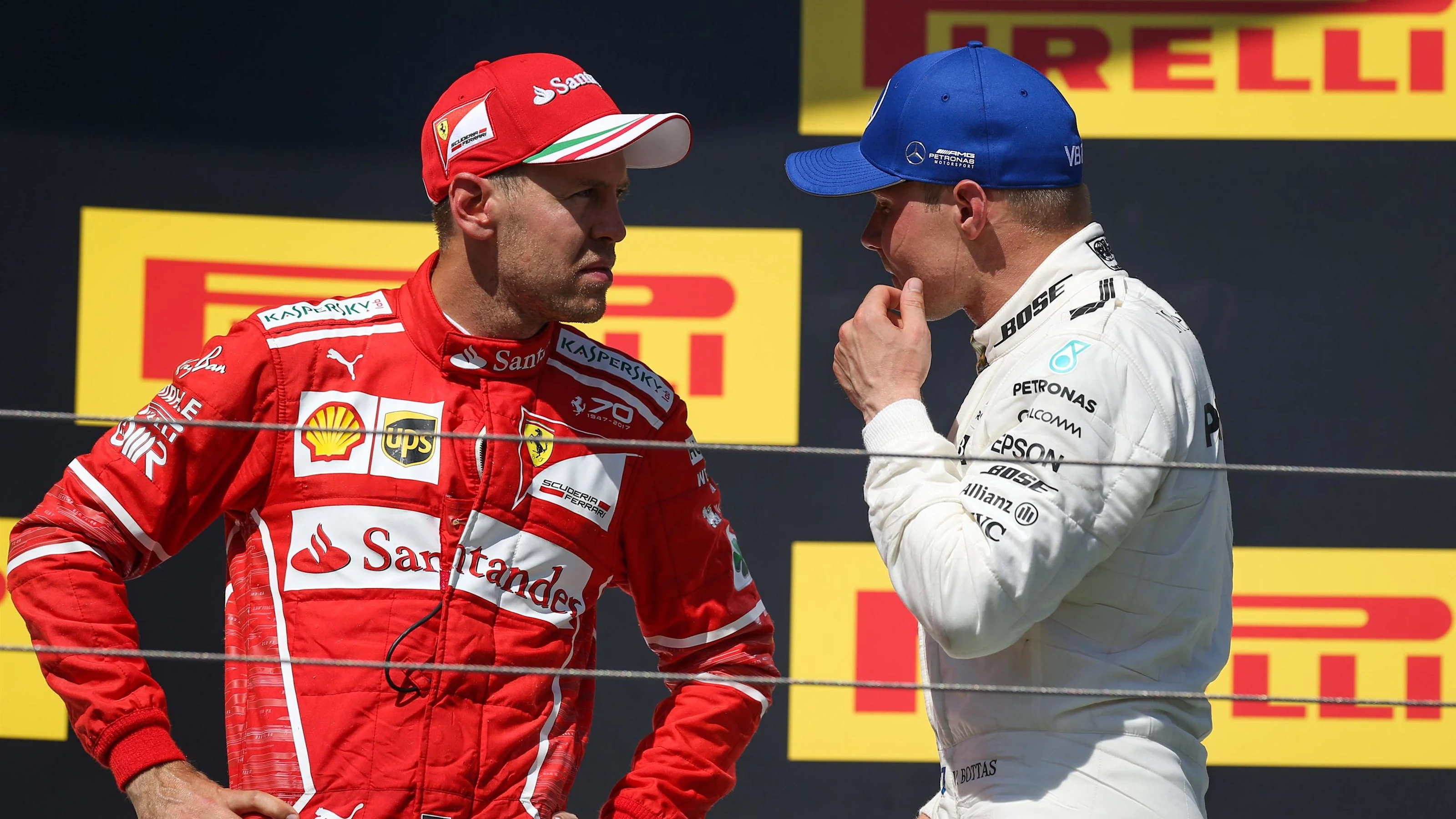 Race winner Sebastian Vettel (GER) Ferrari celebrates on the podium with Valtteri Bottas (FIN)