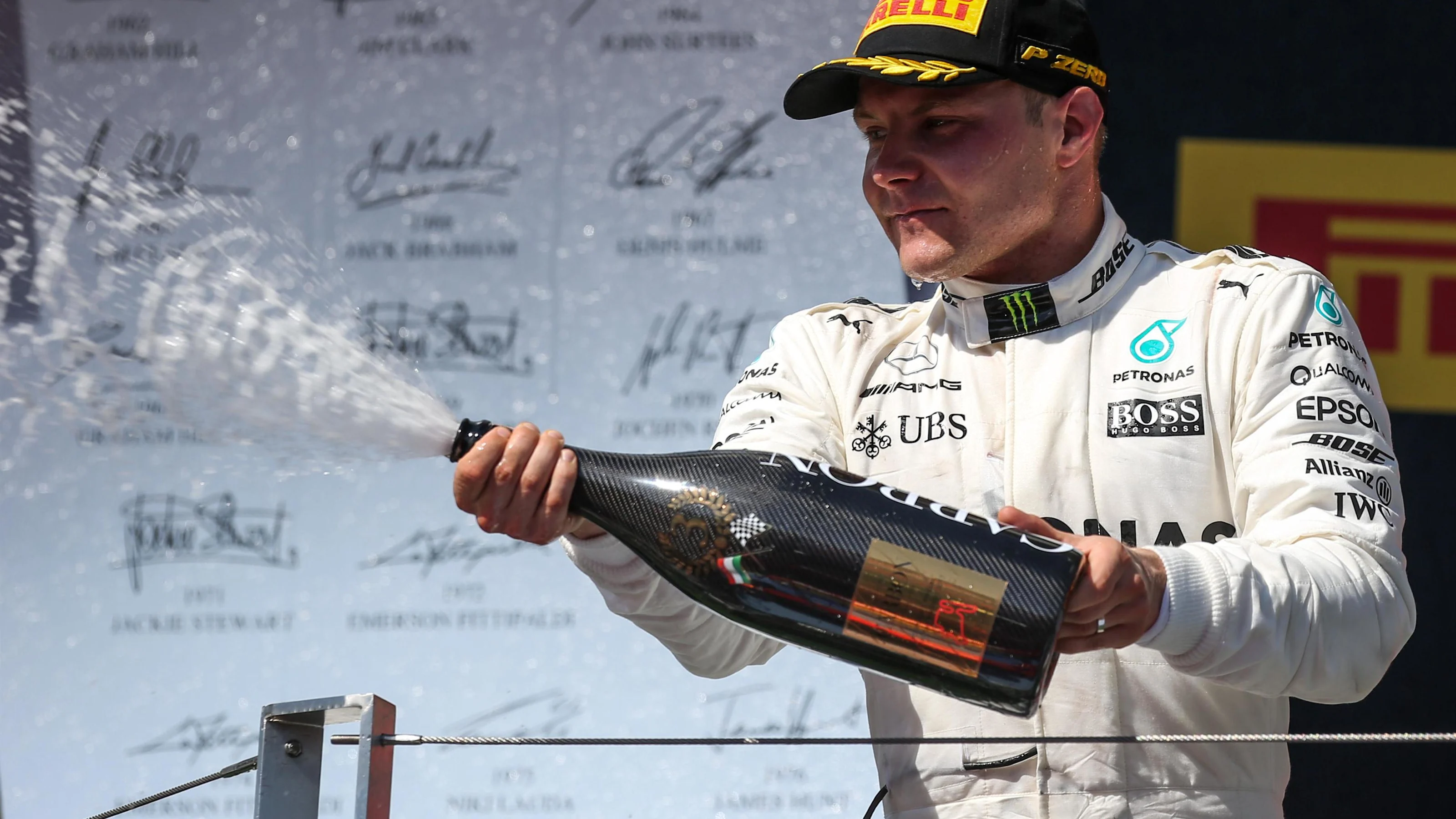 Valtteri Bottas (FIN) Mercedes AMG F1 celebrates on the podium with the champagne at Formula One
